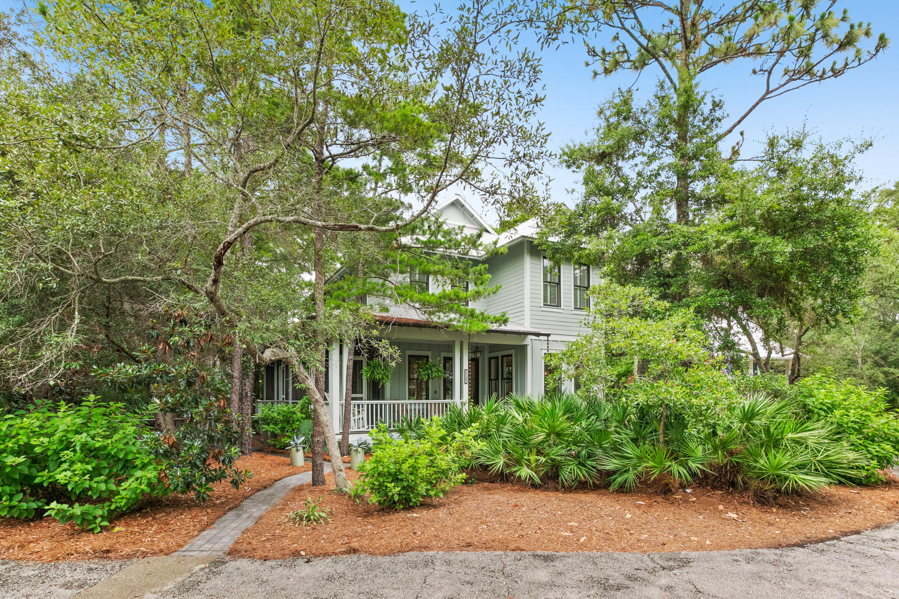 Never rented! This custom 3 bedrooms, 3.5 bath home with media/sitting room is located in the heart of Seagrove Beach. Situated on one of the largest corner lots, the exterior space is built to entertain. The exterior features an expansive wraparound porch screened the length of the home, outdoor gas fire pit, ample seating, grill, outdoor shower and parking for up to 5 vehicles. The interior offers approximately 2,253 square feet and features high end finishes, two master bedrooms, wood flooring throughout, tile in baths/laundry, quartz countertops, 10' ceilings and stainless steel appliances. The great room, kitchen, walk-in pantry, dining, half bath and master bedroom with private bath and access to the porch are situated on the first level. The second level features the master suite