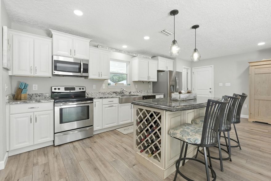 Welcome to this spacious and stylish 4-bedroom, 2-bathroom brick home offering 2,335 sq ft of living space on just under a half-acre corner lot in the heart of Niceville. With a brand-new water heater (2025), HVAC system (2021), and a new roof to be installed before closing, this move-in-ready home checks all the boxes! Step inside to discover luxury vinyl plank flooring throughout the main living areas, recessed lighting, and a neutral color palette that complements any decor. The open-concept kitchen is both elegant and practical, boasting white cabinetry, granite countertops, stainless steel appliances, a large island with seating, and even a built-in wine rack.The spacious primary suite includes a luxurious en-suite bathroom complete with double vanities, a walk-in shower, and a separate soaking tub. All bedrooms are generously sized and filled with natural light.  

The oversized living and dining rooms flow easily into the outdoor space, where you'll find a massive fenced backyard with a concrete patio, perfect for relaxing, entertaining, or grilling out. With plenty of room for a pool, garden, or future shop, this property is ideal for a variety of lifestyles. The corner lot layout also offers convenient access for storing a boat or RV securely in the backyard.  

Additional highlights include copper wiring and plumbing, a two car garage, and charming curb appeal with mature landscaping and the chicken coop can convey!

Don't miss your chance to own this move-in-ready home with all the big-ticket upgrades taken care of. Schedule your private tour today!
