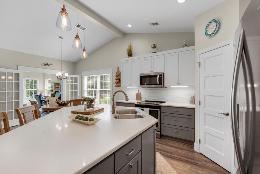 Hey! Yes I'm talking to you! I'm going to let you in on the best, kept local secret -- the bayou life in Freeport! Picture yourself living amid the tranquil setting in this less than 3 year old, one-story private home, located just north of the 331 bridge. This 2 bedroom, 2 bathroom plus office home was constructed with a thoughtful design for functionality, comfort and the view. The living, dining and kitchen area encompass the open concept with many large windows that provide an abundance of natural light and views of the bayou.  Home feels larger than 1790sqft due to the 9 ft ceilings and luxury vinyl throughout. The large kitchen island is the perfect gathering spot for friends and family and seats 4 comfortably. The shaker style cabinets, Quartz counter tops, electric range, soft clos