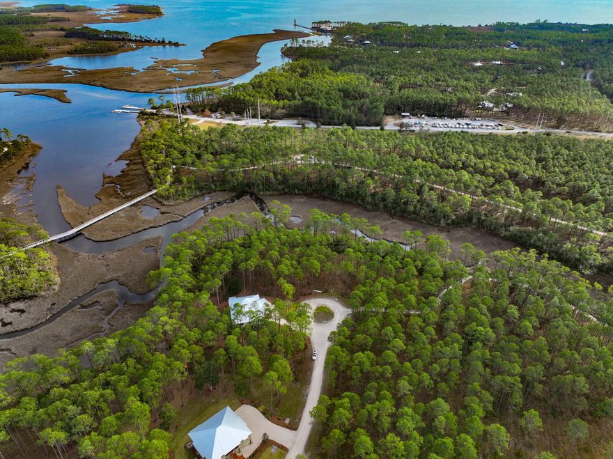 Build your Dream Home on Crooked Creek Lot 22!! It is located in the exclusive St. Joe Community of Rivercamps.  Rivercamps is 1500 acres of pine forest with only 450 homesites on 500 acres and the remaining 1000 acres for conservation.  Enjoy the peace and serenity of this beautiful neighborhood but only minutes away from Panama City International Airport, Emerald Coast White Sandy Beaches, and Pier Park shopping and restaurants.The amenities include a 7 mile walking trail, community boat ramp, day-use boat slips, dry boat storage, kayaks, canoes, bikes, pool, fitness center, commercial kitchen for your use. This is a must see.