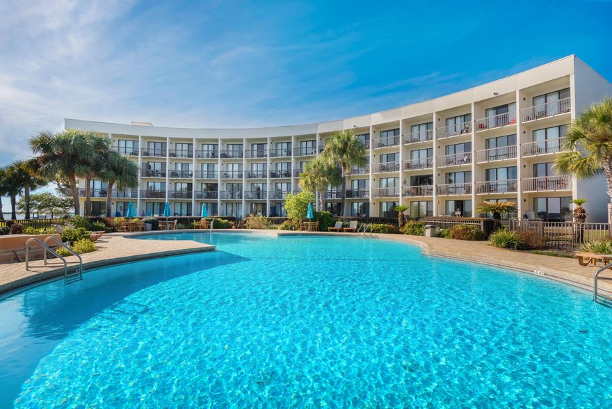 Welcome to your dream waterfront studio condo, located on the 4th (top) floor with breathtaking views of the water. This elegant and modern condo has everything you need for a luxurious and comfortable living experience. Step inside and you will be greeted with an open and spacious studio layout, with ample natural light streaming in from the floor-to-ceiling windows. The condo boasts full-size appliances, including a refrigerator and stove making it a perfect space for those who love to cook and entertain. One of the standout features of this condo is the private pool, which is exclusively for the use of the condo's residents. A brabd bew 12,000 btu AC unit installed was installed 2022.