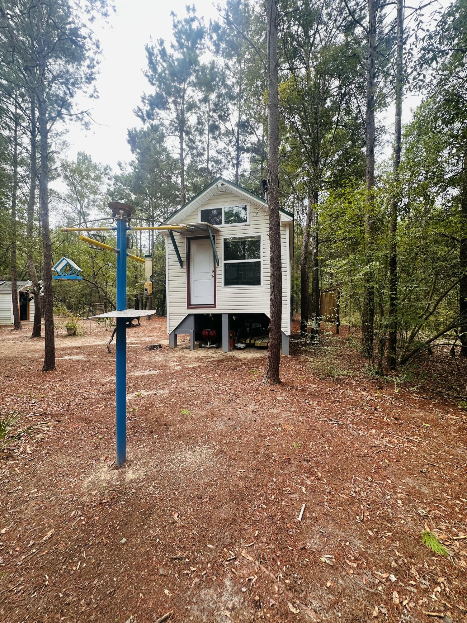 Welcome to your future homestead dream! Spread across three parcels, this unique property is being sold as vacant land, but the vision is already well underway. The current owners have built six structures, including two starter cabins, a workshop, and a kitchen building. Designed for off-grid living with solar and generator power, the property provides the perfect foundation for a self-sustainable lifestyle. Please note there is no septic, water, or electric installed.Step outside and imagine harvesting from your own plentiful vegetable garden, where rich soil and open space give you the chance to grow a bounty of fresh produce year-round. Whether you envision homesteading, raising animals, or simply enjoying the peace and quiet of country living, this property offers a rare opportunity to create the lifestyle you've been dreaming of.
No HOA and minimal restrictions. Modular homes are allowed. Property is located in Flood Zone X and, per Walton County GIS mapping, does not appear to contain wetlands. Easy access to I-10 and CR 285 South makes this property private yet convenient.
Buyer to verify all building codes, zoning regulations, flood zone, wetlands, and utility availability with the appropriate local authorities to ensure the property meets the intended use. Information provided is deemed reliable but not guaranteed.