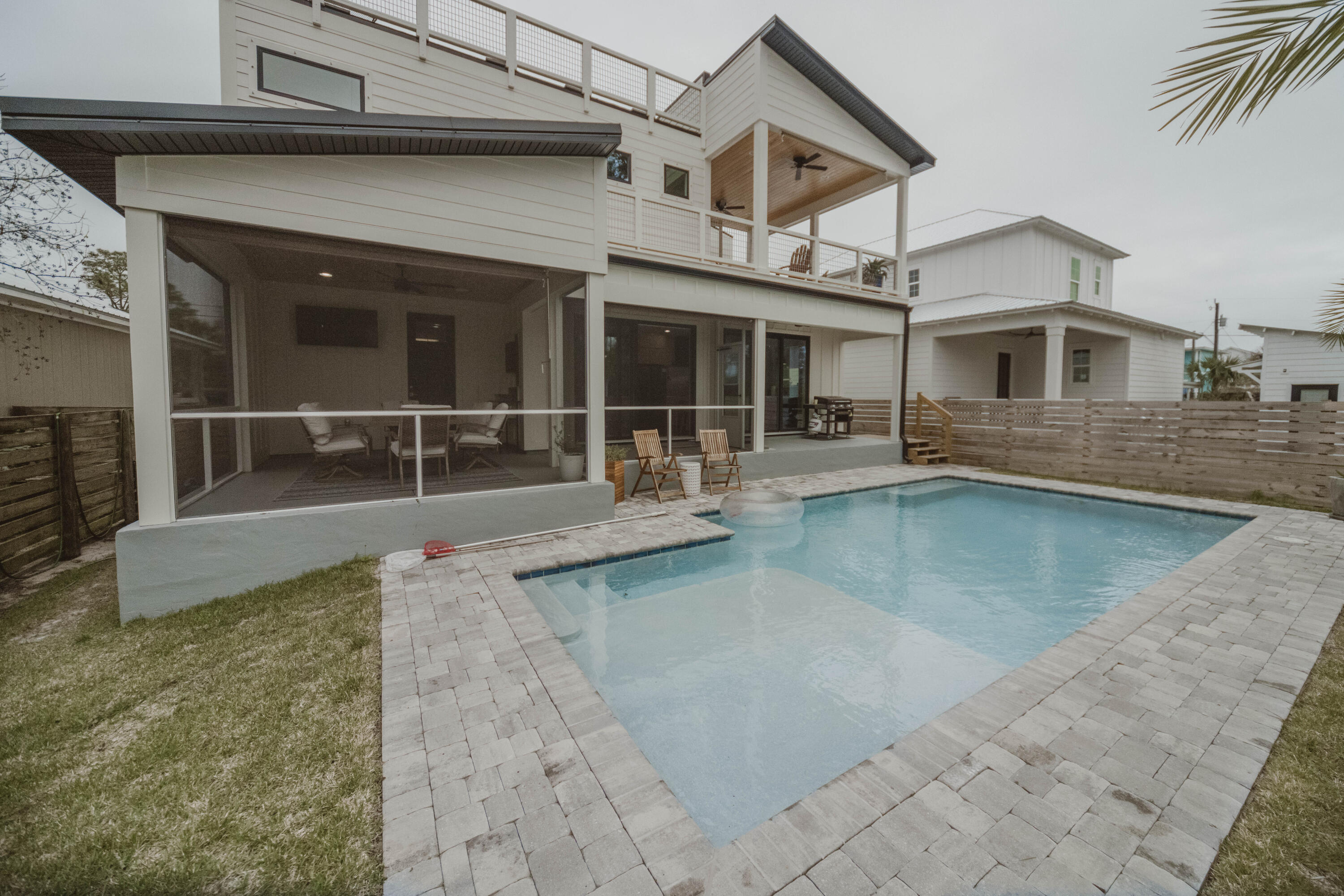 Experience this immaculate, custom modern beach home, 3.2 MILES AWAY from East 30A! Indulge in our beautiful beaches &#127754; Perfect for a prime residence or will exceed expectations as a vacation rental!MAIN FLOOR:~ Bedroom (immediately to right)~ Living Area w/ Electric Fireplace & Built-In Shelving~ Custom Kitchen w/ Custom Tile Work + Industrial Range Hood~ Full Bathroom w/ Stand-Up Shower, accessed FROM outdoor deck OR from main living space~ Large Screened-In Deck (perfect for family gatherings!)~ 1 Car GarageSECOND FLOOR:~ Large Entertaining Deck~ Master Suite + En-suite (Stand-Alone Tub + Stand-Up Shower) + Walk-In Closet~ Front Bedroom~ Full Bathroom w/ Tub/Shower Combo~ Spacious Laundry RoomTHIRD FLOOR LOOKOUT/DECK:~ LARGE lookout uncovered deck w/ GULF VIEWS!