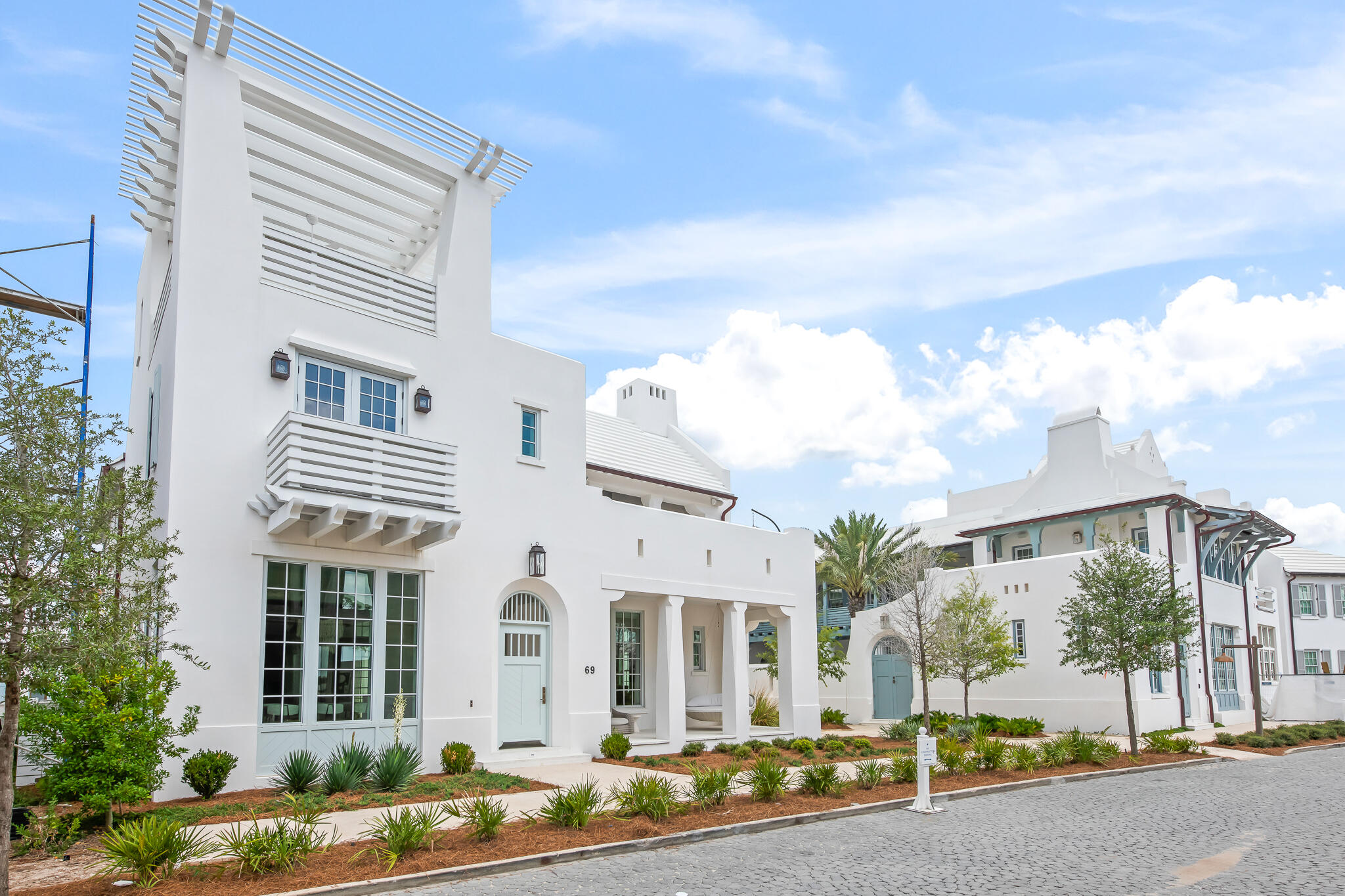 This stunning custom freestanding Alys Beach home recently completed on 69 Plumbago Lane and designed by Jason R. Dunham offers a spacious and thoughtfully designed layout. Amongst the 4,169 conditioned square feet, the house features Two Master Suites, Two Guest Bedroom Suites and two half baths and combines multiple indoor and outdoor living spaces.A large covered second floor outdoor living area equipped with a wet bar, summer kitchen, and fireplace looks west towards sunsets and the nature preserve. A versatile tower room spills out to a third-floor rooftop terrace that provides the iconic mediterranean rooftop views that Alys Beach is known for.A generously sized first-floor living room looks out to the private courtyard and pool and seamlessly connects the kitchen and dining areas.  A large master suite on the first floor provides convenient single-level living. A two-car garage provides ample storage.On the second floor, you'll find another master suite along with two additional guest suites. This level also features a large indoor living room, great for entertaining or relaxing.Upgraded finishes, appliances and audio/visual are found throughout the home. Professional interior furnishings convey with the sale of this home.