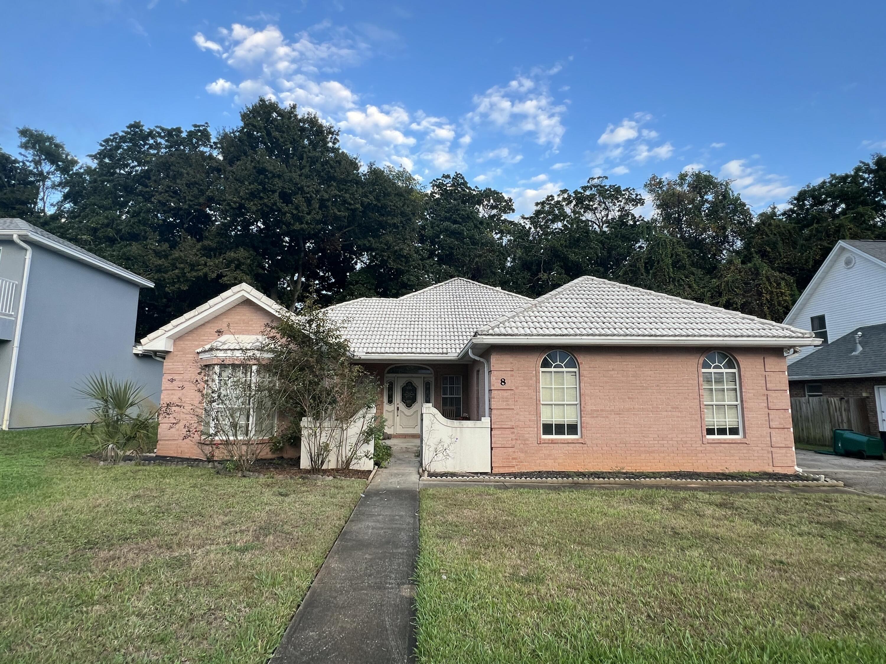 Built in 1995 and located in the popular Islandview Beach community.. this home has so much potential! A split bedroom 3 bedroom 2 bath home with the guest bedrooms having a shared bath. The living room is large with recessed lights, raised ceiling, built in shelving and a fireplace. Kitchen and baths are tiled. Master has a large walk in closet, separate tub and shower as well as toilet closet. This all brick home has a screen back porch, side entry garage, and the community has a pool, and water access. This home is a must see to appreciate, but due to repairs will only qualify for rehab loans. Call today for your viewing!