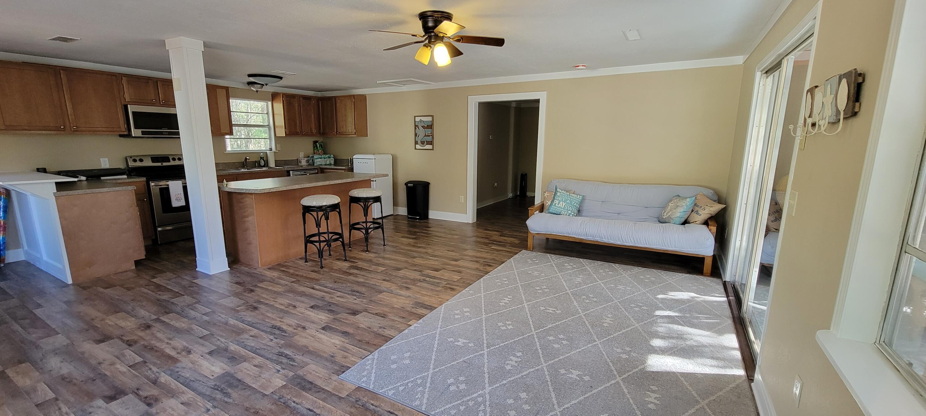 ''Camp Adams Cottage'' Cute Florida Cottage located 20 miles to the Beaches of Walton County and 12 miles to the City of Freeport. Easy to maintain and a great get away spot or an investment property. The home offers covered screened-in front porch, spacious living/dining combo and open kitchen and a total of 4 other rooms: 2 Bedrooms, 1 additional small room (office or an extra bedroom) as well as a second living room area. The home has a back deck with beautiful wooded backyard for privacy and relaxation. Metal Roof-2015, New Kitchen and Laundry Appliances-2021, HVAC-2011, New Motor and Thermostat-2021. Water is shared with the community and it cost $200 per year. All details to be verified by the buyer/buyer's agent. Easy Show! call today!