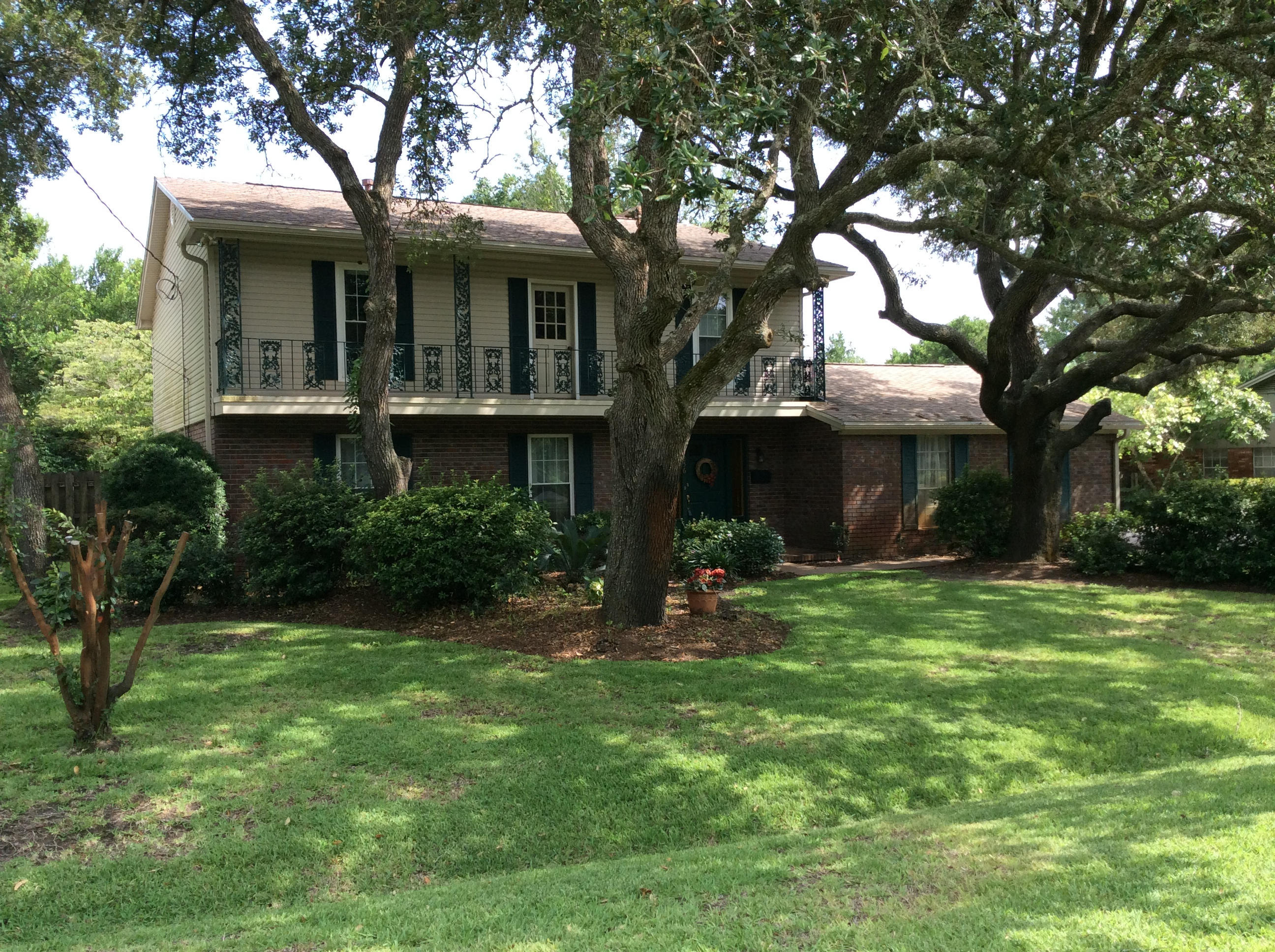 Located across from Cinco Bayou you will find this gorgeous Southern style home nestled among the mature oaks. Minutes from the Fort Walton Yacht Club and central to Eglin or Hurlburt, this beautiful four bedroom home is perfect for any family. With a flowing floor plan, the large formal living room is open to the formal dining room with plenty of space to entertain family and friends. Lots of storage and closets can be found throughout the home. The separate family has a wood burning fireplace and is the perfect gathering space, as it is adjacent to the kitchen. Updated with granite counter tops the high and low breakfast bar can seat up to seven. Hardwood, top of the line laminate floors are throughout the downstairs.