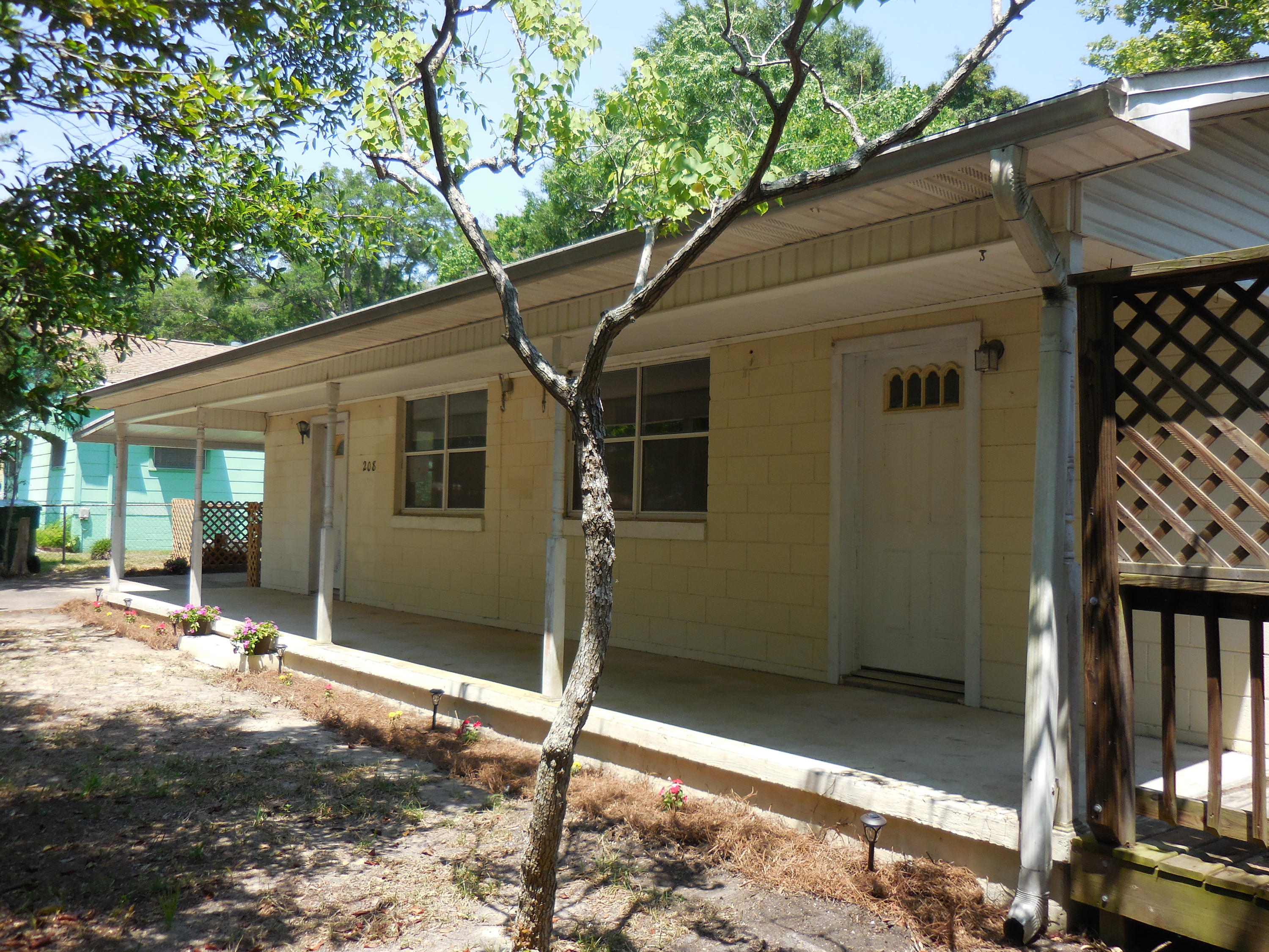 REO. Fannie Mae HomePath property. Great Opportunity for Everyone! This large corner lot is located right across the street from the Park. This roomy 2 bedroom, 2 bath Florida Cottage also features a large living room and a huge eat-in kitchen. Each bedroom has its own bathroom and walk-in closet! There are also two Bonus rooms off each bedroom. The laundry hook-ups are located in an outside laundry/storage room. If you need more storage, a huge shed with an attached outside covered storage area is conveniently located behind the carport.