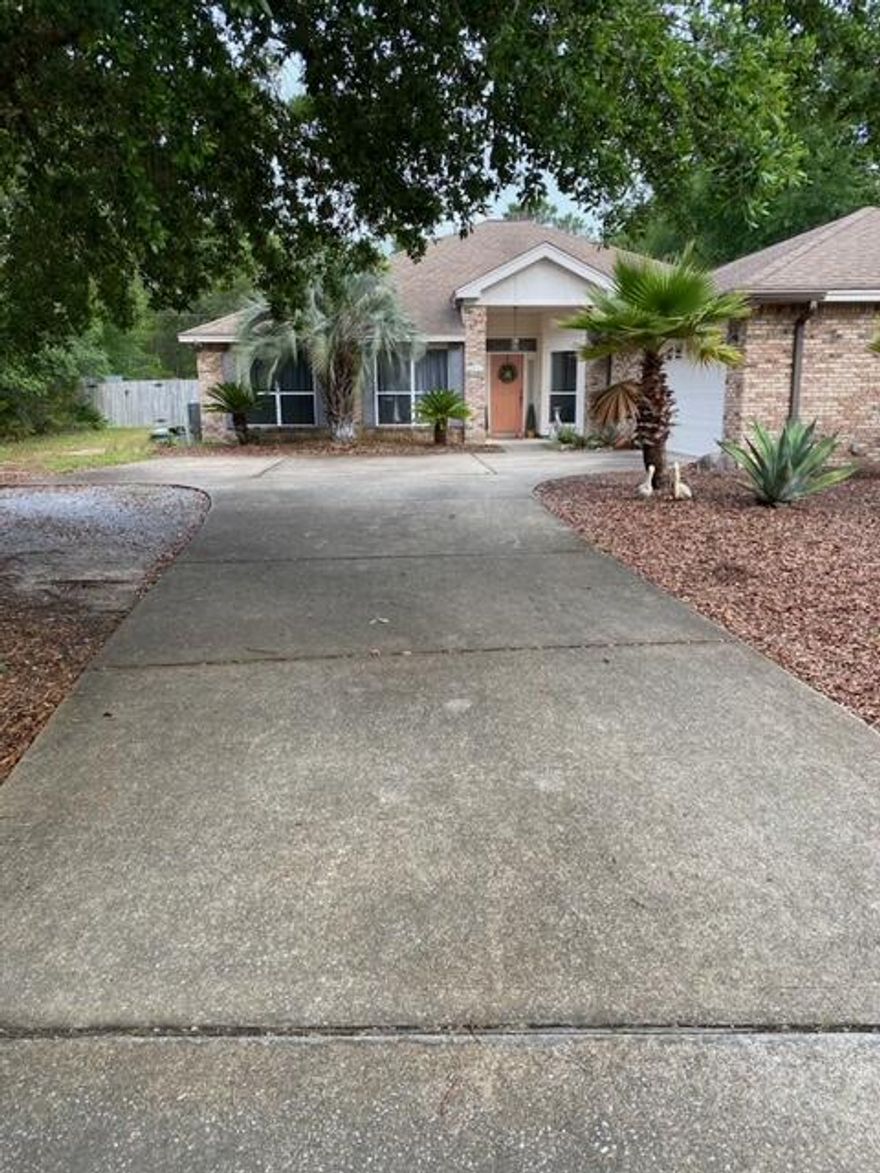 This home is located in the gated community of Pelican Bay.  On one of the larger lots in the subdivision and located on a quiet cul-de-sac with a large inground pool. Pool liner and pump was replaced within the last 4 years.  A/C was replaced within the last 4 years.   4 BR and 2 Baths. Separate dining  and a large living room.  Split bedroom plan with a huge master walk in closet.  Spacious screened in patio. 21x31 oversized garage with room for 2 cars and storage or work area.  Seller may consider a carpet and fence allowance with an acceptable offer.   Short walk to the community bay front park and tennis court.  Great location with just minutes to the beach, shopping and restaurants. New professional photos of the interior and exterior to come in the future.