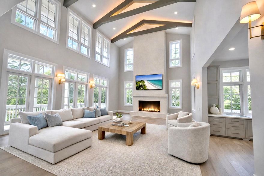 Experience the rare opportunity to own a brand-new, custom-built coastal masterpiece in the exclusive gated community of Lakeplace at Grayton Beach. Scheduled for completion in March 2026, this 5-bedroom, 5.5-bathroom home sits on nearly half an acre, blending timeless coastal elegance with modern luxury.Boasting 5,686 square feet of heated and cooled space and nearly 10,000 square feet under roof, this residence was thoughtfully designed for both refined living and effortless entertaining. The expansive outdoor area features a resort-style pool, spacious lounge, outdoor kitchen, and fire pit, creating the perfect setting for family gatherings or sunset entertaining. A three-car garage and oversized driveway offer ample parking for residents and guests alike. Inside, the grand living room welcomes you with vaulted ceilings, wood-beam accents, and a dramatic sense of space that flows seamlessly into the chef's kitchen. The kitchen is outfitted with Thermador appliances, quartz countertops, a walk-in pantry, and elegant additions such as a built-in wine cooler and coffee barperfect for everyday luxury or hosting.

The primary suite on the main level provides a serene retreat, featuring natural light-filled windows, painted nickel-gap ceilings, and a spa-inspired bathroom with dual vanities, an oversized walk-in shower, soaking tub, and marble flooring. The adjoining custom walk-in closet includes built-ins, a wall safe, and a convenient washer and dryer.

Take the elevator or stairs to the second floor, where you'll find four additional ensuite bedrooms, each with private or easy access to spacious outdoor patios. A second-floor laundry room and linen closet ensure ease and organization, while the open loft living area overlooks the grand living space below.

Nestled between Grayton Beach and WaterColor, Lakeplace at Grayton is a private, short-term rental-restricted community of only 50 homes, situated along a beautiful coastal dune lake. Enjoy community amenities including a dock and pool, and take advantage of easy walking or biking access to nearby restaurants, shops, and scenic 30A attractions.