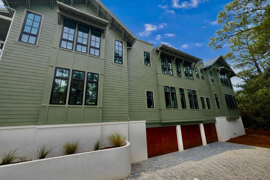 Experience the rare opportunity to own a brand-new, custom-built coastal masterpiece in the exclusive gated community of Lakeplace at Grayton Beach. Scheduled for completion in March 2026, this 5-bedroom, 5.5-bathroom home sits on nearly half an acre, blending timeless coastal elegance with modern luxury.Boasting 5,686 square feet of heated and cooled space and nearly 10,000 square feet under roof, this residence was thoughtfully designed for both refined living and effortless entertaining. The expansive outdoor area features a resort-style pool, spacious lounge, outdoor kitchen, and fire pit, creating the perfect setting for family gatherings or sunset entertaining. A three-car garage and oversized driveway offer ample parking for residents and guests alike. Inside, the grand living room welcomes you with vaulted ceilings, wood-beam accents, and a dramatic sense of space that flows seamlessly into the chef's kitchen. The kitchen is outfitted with Thermador appliances, quartz countertops, a walk-in pantry, and elegant additions such as a built-in wine cooler and coffee barperfect for everyday luxury or hosting.

The primary suite on the main level provides a serene retreat, featuring natural light-filled windows, painted nickel-gap ceilings, and a spa-inspired bathroom with dual vanities, an oversized walk-in shower, soaking tub, and marble flooring. The adjoining custom walk-in closet includes built-ins, a wall safe, and a convenient washer and dryer.

Take the elevator or stairs to the second floor, where you'll find four additional ensuite bedrooms, each with private or easy access to spacious outdoor patios. A second-floor laundry room and linen closet ensure ease and organization, while the open loft living area overlooks the grand living space below.

Nestled between Grayton Beach and WaterColor, Lakeplace at Grayton is a private, short-term rental-restricted community of only 50 homes, situated along a beautiful coastal dune lake. Enjoy community amenities including a dock and pool, and take advantage of easy walking or biking access to nearby restaurants, shops, and scenic 30A attractions.