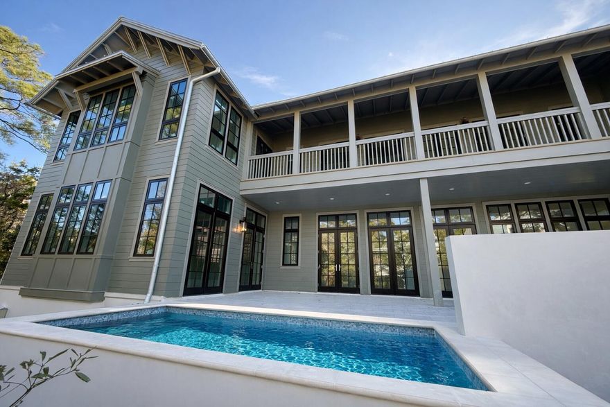 Experience the rare opportunity to own a brand-new, custom-built coastal masterpiece in the exclusive gated community of Lakeplace at Grayton Beach. Scheduled for completion in March 2026, this 5-bedroom, 5.5-bathroom home sits on nearly half an acre, blending timeless coastal elegance with modern luxury.Boasting 5,686 square feet of heated and cooled space and nearly 10,000 square feet under roof, this residence was thoughtfully designed for both refined living and effortless entertaining. The expansive outdoor area features a resort-style pool, spacious lounge, outdoor kitchen, and fire pit, creating the perfect setting for family gatherings or sunset entertaining. A three-car garage and oversized driveway offer ample parking for residents and guests alike. Inside, the grand living room welcomes you with vaulted ceilings, wood-beam accents, and a dramatic sense of space that flows seamlessly into the chef's kitchen. The kitchen is outfitted with Thermador appliances, quartz countertops, a walk-in pantry, and elegant additions such as a built-in wine cooler and coffee barperfect for everyday luxury or hosting.

The primary suite on the main level provides a serene retreat, featuring natural light-filled windows, painted nickel-gap ceilings, and a spa-inspired bathroom with dual vanities, an oversized walk-in shower, soaking tub, and marble flooring. The adjoining custom walk-in closet includes built-ins, a wall safe, and a convenient washer and dryer.

Take the elevator or stairs to the second floor, where you'll find four additional ensuite bedrooms, each with private or easy access to spacious outdoor patios. A second-floor laundry room and linen closet ensure ease and organization, while the open loft living area overlooks the grand living space below.

Nestled between Grayton Beach and WaterColor, Lakeplace at Grayton is a private, short-term rental-restricted community of only 50 homes, situated along a beautiful coastal dune lake. Enjoy community amenities including a dock and pool, and take advantage of easy walking or biking access to nearby restaurants, shops, and scenic 30A attractions.