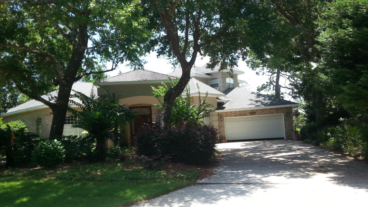 JUST REDUCED This absolutely stunning waterfront home is equipped with the prestigious 1999 Aurora Award winning floor plan. You will simply be amazed with the many outstanding architectural features this grand home has to offer. Being situated on Weekley Bayou allows this property to have a high elevation and well protected lot from storms, so flood insurance is Not required. This property has been very well maintained, the seller has just recently done the following improvements to the home: New window on water side of home, 30-year Dimensional shingle roof with secondary roof barrier, carpet, vinyl pool liner, new railing on back deck, lawn pump and motor, hot water heater, Zoysia grass. Greeted by the massive brick and stucco portico is just the start of its stunning beauty