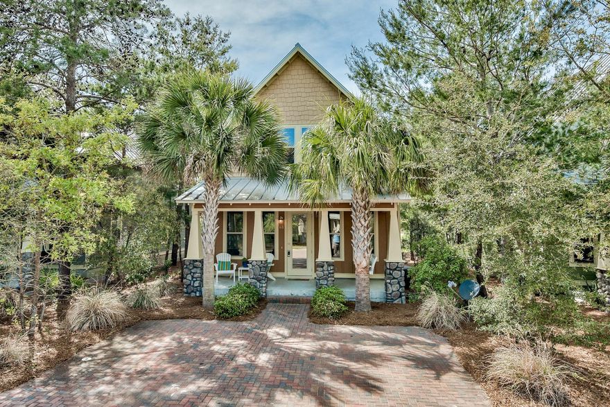 Craftsman Beach Bungalow located in the community of Cottages of Santa Rosa Beach where it's a very short stroll to Ed Walline Public Beach access and Gulf Place, which offers a handful of charming cafes and restaurants, shops, outdoor concerts and festivities. This property is a relaxing retreat with 4 bedrooms and 3.5 bathrooms with room for everyone to spread out. Welcome guests while sitting on your covered front porch with beautiful stone columns, as you enter through the French door to the open floor plan, high ceilings and large sunny windows creates an inviting environment. Kitchen has granite counters, subway tile backsplash and stainless appliances and a large pantry. The first level offers ease of comfort with a guest half bath and a master bedroom with ensuite bath (recently up