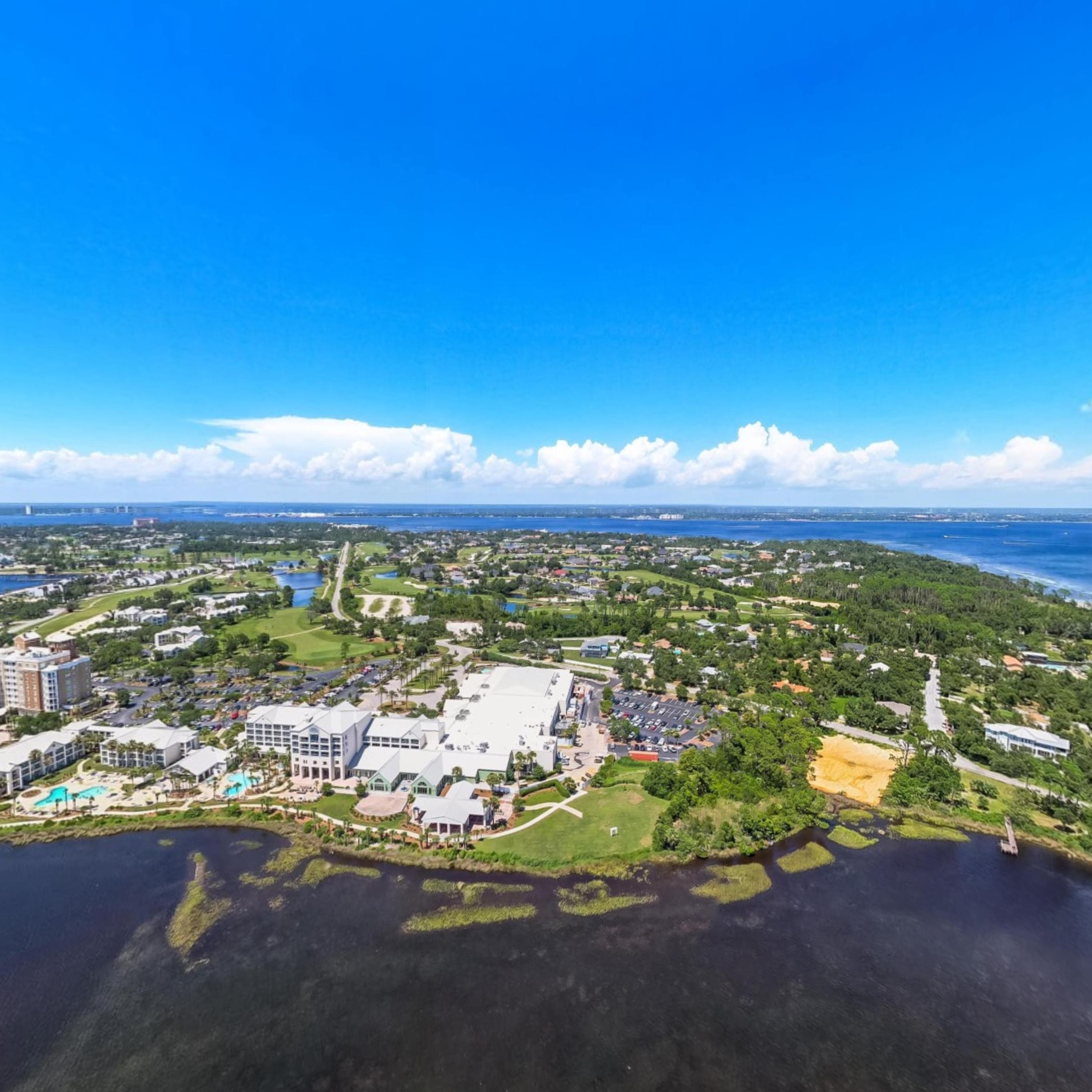 Investor alert! Don't miss this rare opportunity to maximize rental potential with a custom home, multi-family project or Bed & Breakfast on this oversized 85' x 165' (.33 acres) waterfront Bay/Lagoon lot in Panama City Beach. Conveniently located adjacent to Sheraton Hotel Bay Pointe amenities, this primely situated western waterfront lot has Bay/Lagoon views and views of Shell Island. Parcel is permitted for either 6,000 SF single family home or 6,200 SF duplex featuring approximately 3,100 sf each and four to five bedrooms. Property is zoned SR-1 Seasonal/Resort Residential with allowable building uses to include: R-1, R-3, R-5 and R-5A uses, Rental Beach Houses and Cottages, Bed and Breakfasts or Public Lodging Establishments not to exceed 60' in height. No HOA.
