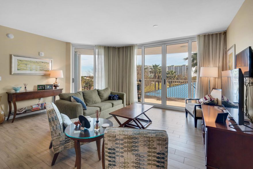 This RARE 3 BEDROOM UNIT end unit has UPGRADED wood plank tile flooring throughout the living spaces. Whether sneaking away for a quick beach weekend or moving in fulltime you will love your time spent in this beach getaway! Enjoy amazing sunset views after a long day of work or play on the spacious balcony or inside from most every room! Resort living at your fingertips-lagoon pool, hot tub, kiddie pool, fitness center, tennis courts, basketball court, conference center, event facility, jogging trail and much more!