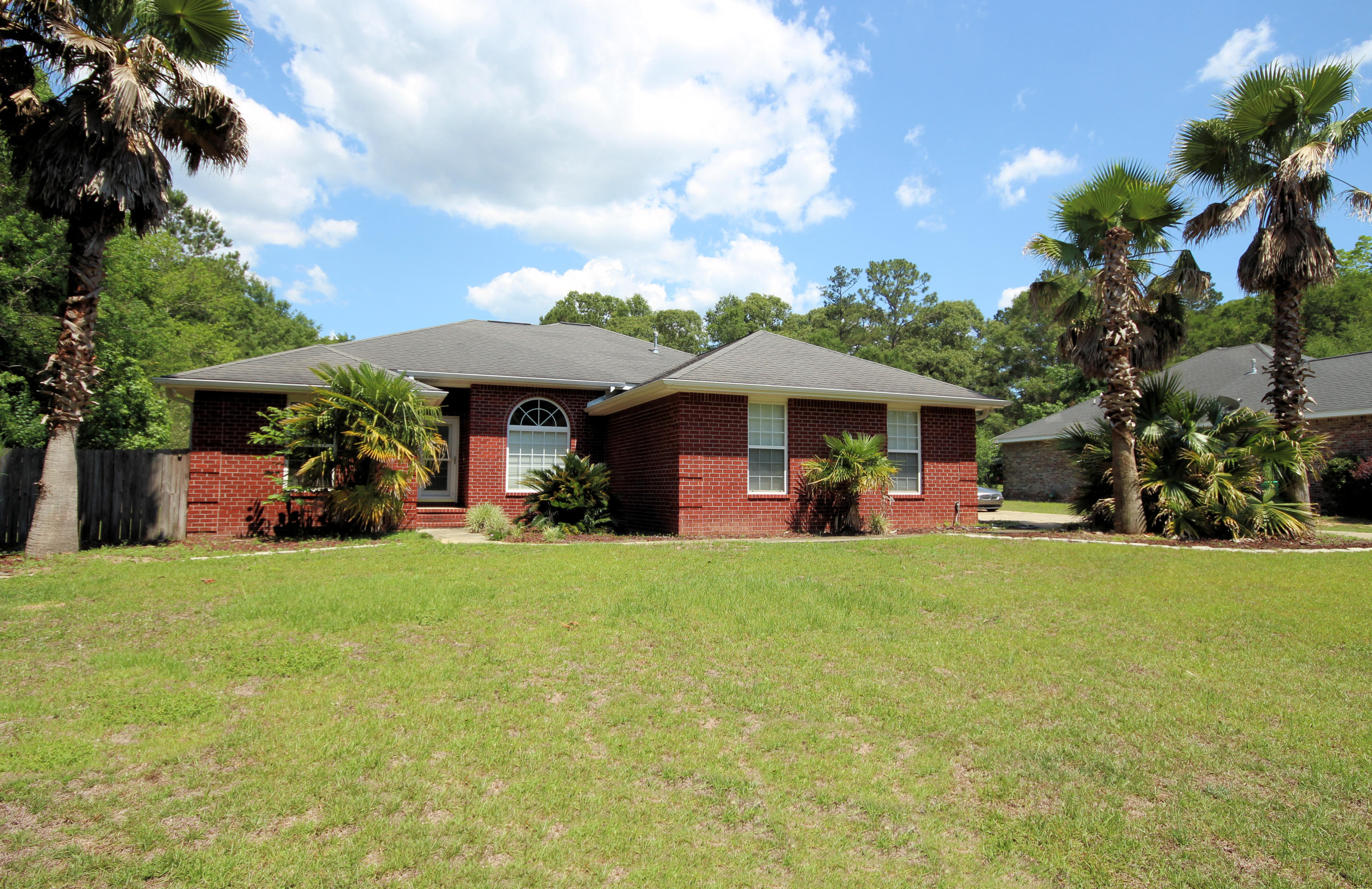 Your back yard retreat awaits. Come home and enjoy relaxing around the fire pit or head into the spacious Florida room and let the day go by. The yard is so large that the list of outdoor activities that you can set up is a long one. Head on back inside and enjoy the great floor plan. The living room boasts a beautiful fireplace and has plenty of room for your furniture. The chef of the house will enjoy the kitchen with it's stainless steel appliances and breakfast bar. Have a quick bite to eat at the bar or have a more personal meal in the formal dining area. The master bedroom which is separated from the rest of the bedrooms, is ample sized and has a very relaxing feel. Double vanities in the master bath ensures that morning routines are quick. Sitting on a huge lot, this home has it all