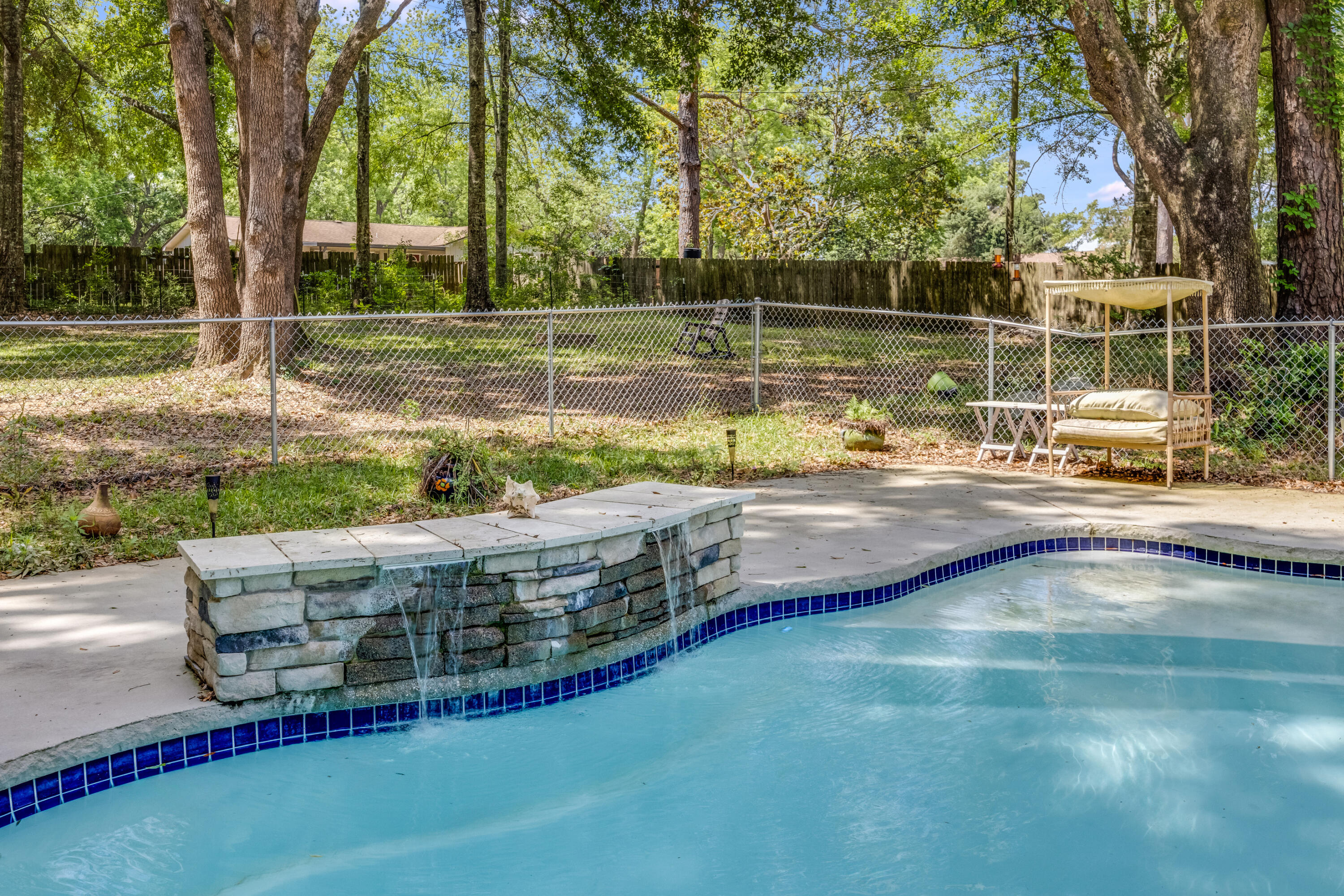 This 3 bedroom, 2 bathroom home with a bonus room, is situated on over an acre and features recent upgrades throughout. The interior has been updated with new luxury vinyl plank flooring, and the home is equipped with paid off solar panels for improved energy efficiency.The primary suite includes a spacious bathroom with a whirlpool bathtub and a separate stand-up shower. The backyard includes an in-ground pool and a detached shed, providing additional storage or workspace.Located just minutes from Beulah Middle School, Publix, Wawa, and the Navy Federal Recreation Center, this property offers both space and convenience.Buyer to verify all measurements and information deemed important.