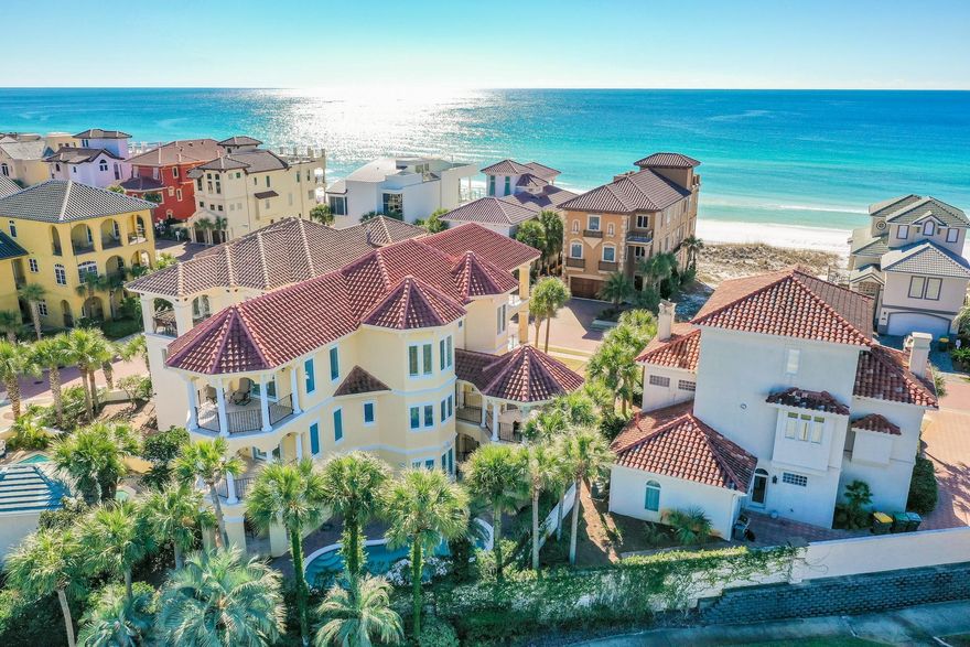 1st Tier Mediterranean villa with sweeping Gulf and lake views and a rare, full-size heated pool and spa in exclusive, guard-gated Destiny by the Sea. Recently updated by Ono Horn Design in today's neutrals and located on one of DBTS's largest lots. The home''s strategic octagonal design receives a remarkable amount of natural light, offers incomparable 360-degree views, and maximizes energy efficiency. Never rented and immaculate, vacation rental projections top $159K annually. This home commands fresh air space with a record 7 balconies. The kitchen features the axioms of a gourmet kitchen - granite counters, stainless appliances, plenty of workspace, and seating. Plus, its octagonal shape and see-through glass cabinets ensure unobstructed views. An elevator services all three floors.