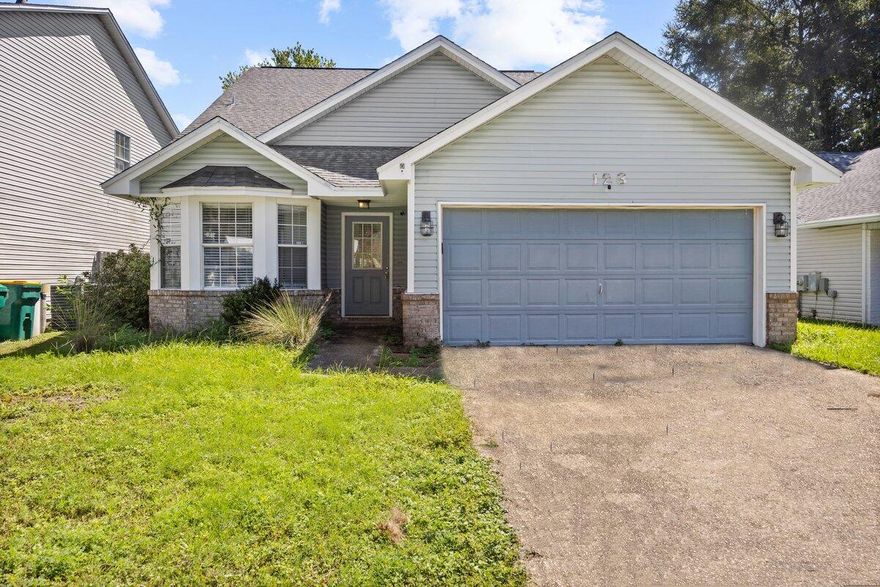 FRESHLY REPAINTED! SELLER WILL REPLACE ROOF AT CLOSING! Value packed opportunity! Conveniently located in the neighborhood of Indigo Village, Bluewater Bay. Only three minutes from the Mid-Bay Bridge connector where shopping opportunities abound and the sugar white Destin beaches await you. Fresh mulch and blooming flowers adorn the front exterior. The Sherwin Williams paint color watery provides a relaxing feel downstairs from the moment you walk in the door. Upon entering your newly remodeled kitchen greets you with a granite top island which doubles as a breakfast bar and flows into the dining area. The kitchen's layout is different from the standard home in the neighborhood. The large bay window gives you full view to the front yard and provides an abundance of natural lighting. Dining area flows from the kitchen and a half wall separates it from the sunken living room where the focal point is the ceramic tile wrapped gas fireplace and a mantle for your favorite photos. The sliding glass doors lead to the rear yard. The first floor master bedroom has closet storage under the stairs, plus closet storage in the master bathroom. The master bedroom has a sliding glass door that leads to the backyard. The upstairs loft makes for a great playroom area, homework station, home office, or even a workout area. The two additional bedrooms face the rear of the house which have an overview of the backyard. The upstairs bathroom is centered between the two bedrooms. Ceramic tile and laminate flooring throughout make for an easy Swiffer sweep cleanup. The appliances, granite countertops, and cabinets, that include soft close drawers, are all upgraded!  Call your favorite agent for a showing today!