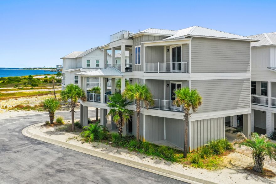 Nestled along the shimmering Intracoastal Waterway, 1471 Seaside Circle in Navarre, FL is a bespoke masterpiece that tantalizes the senses like a fine vintage Bordeaux. This custom-built 4-bed, 4-bath residence boasts an intoxicating bouquet of luxury and coastal charm.
As you approach, notes of architectural elegance dance on the breeze, hinting at the opulence within. The grand entrance unfolds with a robust body of open spaces, revealing layers of exquisite craftsmanship and premium finishes. The home's palette is a harmonious blend of coastal hues, with undertones of sophistication that linger on the palate of your imagination. Sun-drenched living areas offer a full-bodied experience of waterfront living, while the gourmet kitchen presents a complex array of top-tier appliances and finishes.
The master suite, a private reserve of tranquility, opens to breathtaking water views - a finish as smooth and satisfying as the finest Sauternes. Three additional en-suite bedrooms provide ample space for guests to savor the coastal lifestyle.
This home's crowning glory - the panoramic vistas of the Intracoastal Waterway - offers a bouquet that evolves with each passing hour, from sunrise to sunset. Like a well-cellared wine, this property will only appreciate with time, offering a lifetime of memorable moments to be savored and shared.