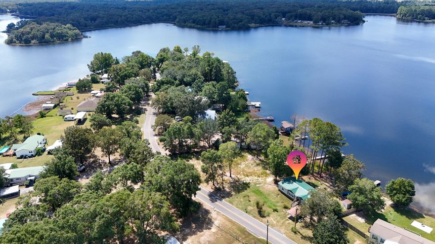 Affordable Waterfront Retreat! This nearly new 2021 home on Paradise Island Dr. sits on nearly half an acre with shady trees, a private dock, and sensational lake views you'll never get tired of. The split floor plan, eat-in kitchen with island and luxury vinyl floors make everyday living a joy. The master features a dbl vanity, walk-in shower and soaking tub. Outside you have the space to play, garden, or just relax with the breeze off the water. Paradise Island is a unique peninsula jutting out into King Lake, creating a tucked away retreat. King Lake offers appx 580 acres of world class fishing with black bass, crappie, shell-cracker, catfish and bream. Whether you're after a weekend getaway or full-time living, this spot checks all the boxes and leaves room for your own touches.