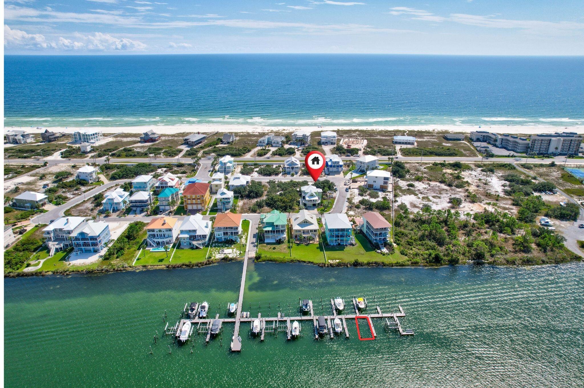 Come build your dream home in Parasol West - a boat lover's utopia! This corner lot includes an assigned boat slip equipped with a 10,000lb boat lift just steps away, and a Beach Mouse Permit! You'll enjoy beautiful water views of Ole River AND the Gulf of Mexico, from one of Perdido Key's only gated rent-restricted communities. This community comes complete with: Deep water boating facilities, boat docks and boat launch, and a community pool with grilling area and pool house. It is located just 1.7 miles to WORLD FAMOUS Flora-Bama and no more than 5 minutes to public access to Perdido Key Beaches.