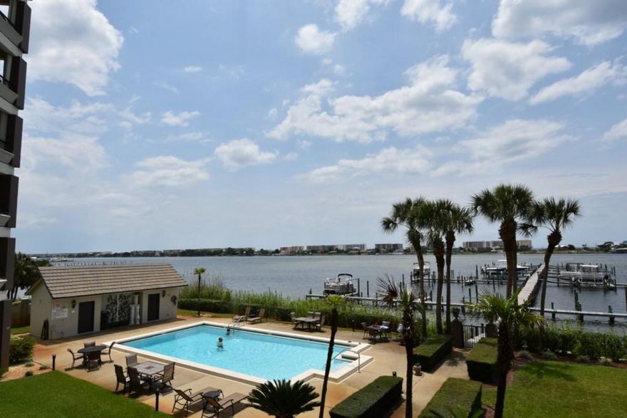 WATERFRONT on the Santa Rosa Sound, and a view of the Gulf! Gorgeous Condominium, TWO HUNDRED WEST, is coastal living at its finest! Private, non-rental building is secured with Pool, Dock, and Boat Slip #12. Enjoy evening sunsets and gulf breezes on your private Balcony and a view of the immaculate grounds! Seller is offering a 1 Yr Home Warranty. Home is equipped with all appliances, including the Washer & Dryer! Kitchen has two Breakfast Bars, plenty of cabinet space, pantry, and a 2nd sink. Sub-Zero Fridge, Jennair Range and Oven, Dishwasher, Microwave, and ICE MACHINE! Enjoy views from the Dining, Kitchen, Living, and Master Bedroom! Master Bath has walk-in-closet, jetted tub, cultured marble vanity, and separate shower. Schedule your Private Showing TODAY! HOA Fees include: building insurance, pest control, ground keeping, water, sewer, garbage, cable, management, and accounting. 
Boat Slip is 30' Long and 17' Wide.
Some furnishings are available for purchase.
Home warranty is with American Home Shield for a value of $405. check out the pictures for additional information and Owner Tidbits! SF is taken from county Property Appraiser's records. Please verify zoning, school zones, and any other information that is important to you.