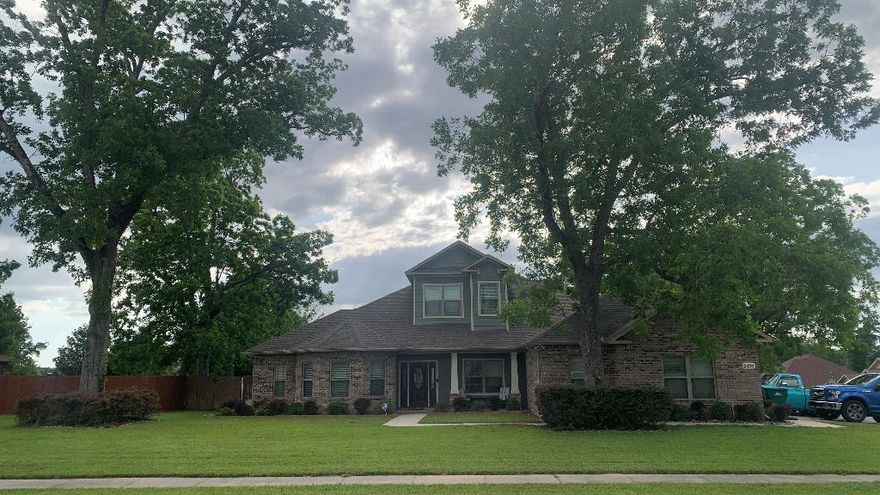 Custom home on a large corner lot in Carnegie Hills. This gorgeous home has mature pecan trees and fully irrigated lawn. The home boasts over 4080 sqf living with 4 bedrooms, 3 full baths, and two half baths plus an oversized 2 car garage. The home has full spray foam insulation keeping this large house very energy efficient. Once in the home you will find a custom gourmet kitchen that gives you all the storage space and counter space for you could need The maple cabinets with raised panels are custom designed for form and function. You will also find a large walk-in pantry, kitchen island with sink, and a breakfast bar. The living room features a coffered ceiling with large crown molding. The spacious den has 10' tray ceiling and in wall surround sound. There is also a separate office
