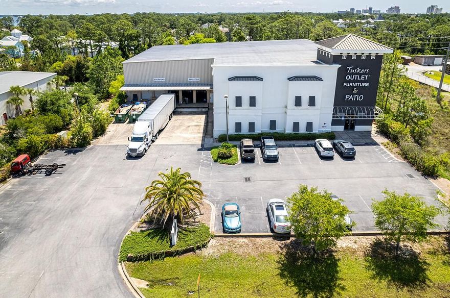 This subject listing offers the Tusker's warehouse, excluding the freestanding retail building fronting Highway 98 (freestanding retail building also available via MLS 978842). This rare assemblage of prime retail, showroom, and warehouse does not currently exist in the local market, which is adjacent to the synergistic retail nucleus of Silver Sands Premium Outlets and centralized to all the local mixed-use districts, successfully drawing population from all local peripheral sub-markets, including but not limited to Destin and Scenic 30A of Santa Rosa Beach, Florida. Fronting Highway 98 in Miramar Beach, nearly 50,000 vehicles pass by its 196 fronting feet daily, which ingress and egress lures the traffic into the retail facilities through the convenience of... the traffic light at N. Geronimo Street and Highway 98. The current owner has committed significant capital to renovate both buildings, which even includes approximately $300,000 for new escalators to service the second floor of the main showroom.  Parcel 1 contains a two-story building, oriented on ??1.18 acres, hosting prime retail and showroom space, as well as private offices, collectively measuring ??26,893 conditioned square feet. There is a 3rd floor that accommodates a spectacular executive office, accessible via a private & secured "floating" staircase. The structural integrity of the building is phenomenal, and the finishes throughout are exceptional. Parcel 2 contains a warehouse, office, and showroom, situated on ??2 acres, and constructed in 2004, measuring ??11,282 SF on two floors. The warehouse contains a broad loading dock area and massive rack system with a lift and guide rails. Both buildings project an architecturally magnificent image.  This opportunity is irreplaceable locally, as land development code would neither accommodate this massive yield, nor would a developer endeavor upon such a project, as the inflationary costs of this era, coupled with land costs, (even if such prime vacant land at a traffic light were available, which is non-existent), would likely much exceed $20,000,000+. The current business is operating a record-breaking levels, year over year; thus the attributable value to this extremely prime site and assemblage is likely understated.  All showings are by appointment only and require a minimum of 48+ hours advanced notice. The listing broker must accompany all showings. Financial credentials are required prior to confirmation of any showings. Please do not approach any onsite staff.