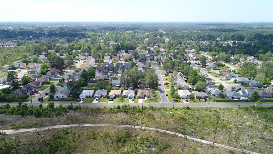 Multiple Offers Received... Submit highest and best offer by 5 pm April 27th (SEE AGENT NOTES). Former US Gold Medal Senior Olympian's home.. NOW AVAILABLE.. and just 5 minutes to the gates of Hurlburt Field! One of the largest corner lots in the neighborhood, this 3 BR/2 Bath home offers beautiful views of Eglin Reserve. Plenty of room to park cars.. with 2 different driveways.. one leading to a 5 inch slab. The slab was designed for a very large RV or boat(RV hookup and 50 AMP service already in place). There's another surprise behind the privacy fence.. a Swim Spa Trainer Pool! Can you guess which Olympic sport the former owner competed in? The pool/spa is housed inside an enormous sunroom, which doubles as a greenhouse. Inside the amenities...