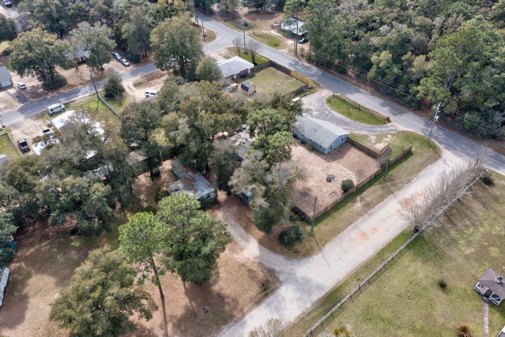 Investment Opportunity - 6225 Goliath Rd, Milton, FL. Bring your vision and make it a reality! This property is being sold AS-IS, and the existing structure is not habitable in its current condition--making it a prime opportunity for investors, builders, or anyone looking for a blank canvas. Located in a peaceful area of Milton, this lot offers a great setting for your next project. Whether you're planning to place a new manufactured home or build your custom dream home from the ground up, this property provides a solid foundation to work with. With convenient access to local amenities, schools, and major roadways, the location offers both privacy and accessibility.