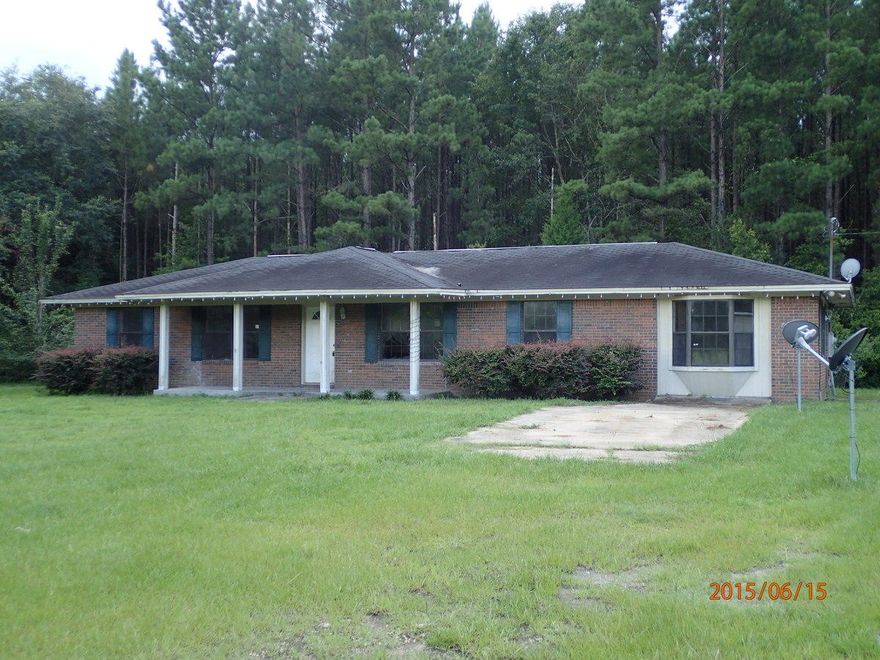 This is an REO home and located just minutes from the interstate! Built in 1984, this large home has 4 bedrooms 2 baths and indoor laundry. The exterior is all brick and the 1 acre lot is completely fenced with a detached 2 car garage for parking or workshop. This home is priced to sell and based on condition of home. Due to repairs needed, this home will not qualify for all types of financing. An interesting home for either owner occupants or investors, call today before this home is gone.