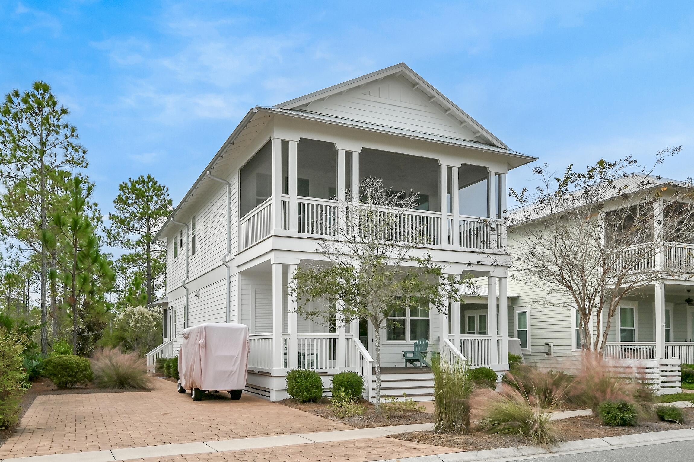 This extraordinary home delivers a coastal lifestyle in a must-see prime location in NatureWalk at Seagrove. It is just down the street from the main entrance of NatureWalk and is right across from the community pool. This is a premier location for anyone that desires easy access to the pool and the clubhouse amenities. This home also backs up to a private wooded preserve, for added privacy. The beach is just a walk or a bike ride away via a nature trail just behind this wonderful home. Spacious, professionally decorated throughout and fully furnished, it's just moments from the sugar-white sands at Seagrove Beach. Outdoor living can be enjoyed to the fullest on two generous screened porches that look out onto mature greenery, the surrounding neighborhood and the community pool. An additional open porch spans the full width of the front entrance providing a traditional southern-style welcome. Brick-paved walkways, golf cart parking and extra-large vehicle parking are complemented by a large storage room for bikes and beach gear. Indoors, this two-story home is based on the most popular Seabreeze floor plan and has bright open living spaces professionally decorated in tones that reflect the nearby beach and coastal vibe. As an extra bonus, a full house generator and a 6 seater golf cart are also included making this the premier opportunity in NatureWalk at Seagrove!