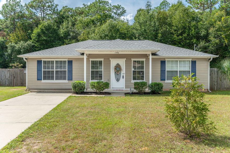 Welcome home! Tucked in a quiet loop-style neighborhood accessible from Dogwood Drive or Stewart Street, this home blends charm, comfort, and convenience. You'll love the farmhouse-inspired kitchen with reclaimed-style whitewashed wood paneling, butcher block counters, stainless steel appliances, and a spacious island bar. The split floor plan offers privacy, and the primary suite features a double vanity and soaking tub. Relax on the covered back patio overlooking the privacy-fenced yard with a 12 X 24 aluminum storage building.  Gutters & downspouts and a 2023 roof, move-in ready and easy to love!