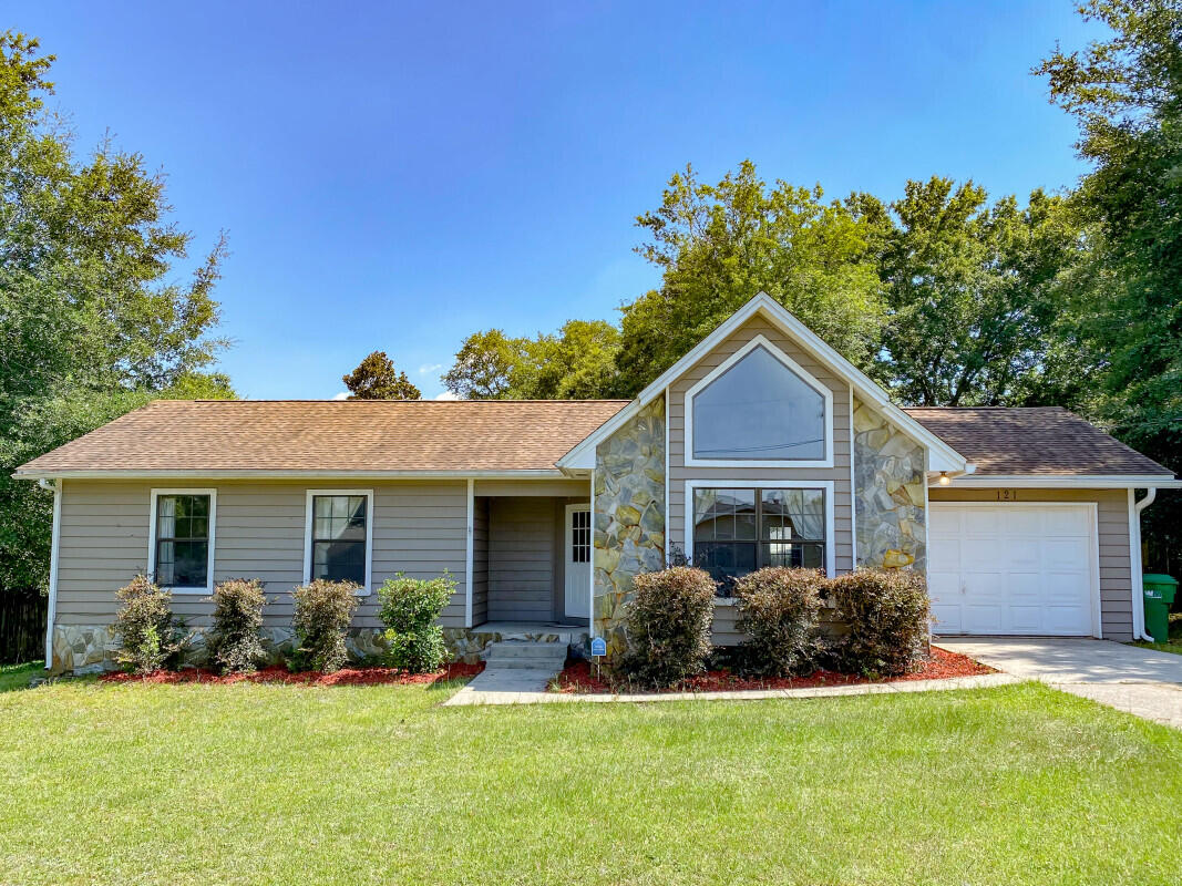 This 3-bedroom 2-bath ranch sits just South of Crestview. Ideally situated to both Duke Field and Eglin Air Force Base, you can enjoy all of the benefits of being near the Gulf Coast yet remain outside the fray. Sitting on .34 acres with spacious front and back yards, there is plenty of outdoor space for the family to enjoy and lots of room for a pool. The large open main living area has a vaulted ceiling with a stone fireplace and access to the rear deck. The large tiled, eat-in kitchen has an abundance of custom oak cabinets and opens to the dining area across a huge breakfast bar. The ceiling here is vaulted as well giving an incredible sensation of space.