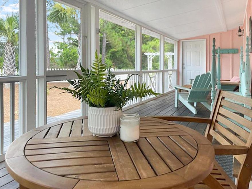 Located in the heart of Seagrove beach just steps to the sugar white sand you will find old Florida charm in this tastefully updated beach cottage situated on a large nearly 1/4 acre corner lot.  Hidden potential abounds, limited only by your creativity and desires. Like a precious jewel box, once opened you quickly discover amazing things come in small packages.  The setting is peaceful serenity.  The porch invites quiet time for coffee and a relaxing wine down to your beach day.   The floor plan is that of an open concept joining living, dining and kitchen in one unity.  Interiors are light and bright with fine finishes such as white quartz countertops, pine hardwood flooring and v groove shiplap ceilings.  Seaside is an easy approximate 1.5 bike ride making this an amazing opportunity