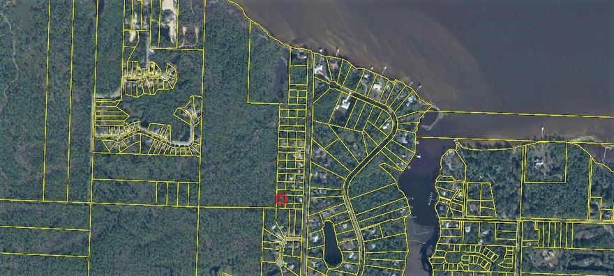Just past Windsor Estates you will find this hideaway. Mario Road is not developed yet, just three homes on a gravel driveway at the front, with Lot #4 tucked away in the back. So there is currently no road access at this time, however, the lot is only a stones throw away. There is new construction all around.  The roads get built as the new homes get built. Take a drive and imagine what you could build on this lot. There is a lot privacy because the lot backs up to the states property. Don Bishop Road is just west of Santa Rosa Plaza and right of the Otto Carwash being built. It's a great location in Santa Rosa Beach, with restaurants, shops and the beach only minutes away.