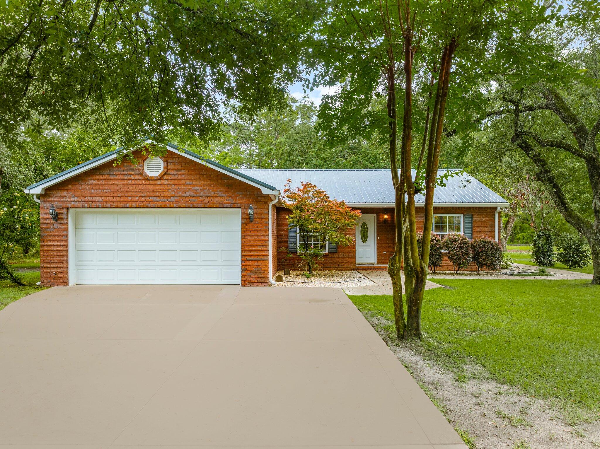 Welcome to your charming abode located in the Bay Grove community of Freeport. This canal-front all brick residence offers a perfect blend of contemporary convenience and classic charm. Situated in a prime location, this open-concept residence entails just shy of 1,500 sq.ft. with 3 bedrooms and 2 bathrooms that has been thoughtfully planned out.You'll enjoy ample space for relaxation and entertainment in the bright and airy living room that's perfect for gatherings of any kind with a beautiful set of French doors leading out to the covered patio. The well-appointed kitchen offers functionality and convenience that boasts honey-maple cabinetry all the way to the ceiling and a center island. Retreat to the primary suite with your own ensuite bathroom with a cultured marble dual vanity, tub/shower combo and a generous walk-in closet. Additional bedrooms offer comfort and versatility for guests or family members with a shared bathroom with a pedestal sink and a tub/shower combo.
Don't forget these notable features throughout such as 8-inch thick steel-framed construction (exterior walls), split-bedroom floorplan, epoxied garage floor, new irrigation pump, metal roof installed in 2021, gutters installed in 2021, expansive tray ceiling, updated plush carpets in bedrooms, updated driveway, landscaped yard with mature Oak trees and Crepe Myrtles and more.
Step outside to your backyard to open possibilities with what you can create with this blank slate on 0.54 acres with 36ft of canal frontage that leads directly to Mallet Bayou and Choctawhatchee Bay. Enjoy your private stairs down to the shared dock to hop on a kayak or a small watercraft. This backyard space is perfect for outdoor dining/living on the covered patio, gardening, a pool or simply unwinding after a long day.
Enjoy easy access to the beaches of 30A, entertainment venues, shops and restaurants. As an added bonus, this Seller is offering up to $15,000 in "any-way" money for a Buyer to use as they wish with an acceptable offer. This home is not just a residence, it's your paradise! Schedule a showing today and envision yourself in Bay Grove, where comfort and contemporary living unite!