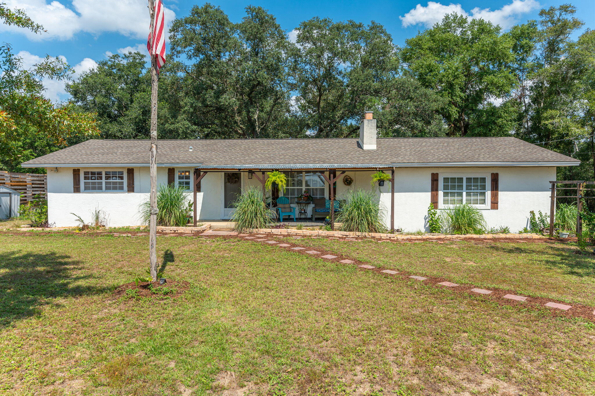 Welcome to your own homestead!  Bring the animals...this charming 3-Bedroom, 2 bath home sits on 3.02 acres and is in SOUTH Crestview! Offering the perfect escape from work with endless possibilities. Enjoy modern touches inside the home with kitchen appliances less than a year old. This house also offers an additional room for an office. Entertain guests or unwind in your backyard retreat, complete with gazebo, fire pit, garden, and RV hook-up. There are 2 sheds for all your outdoor gear.Property also features a chicken coup, handmade goat milking stand, and a versatile animal shelter, making it perfect for hobbyists and animal lovers.  Recent updates include a new water tank for well, a new septic system, and an updated drain field.