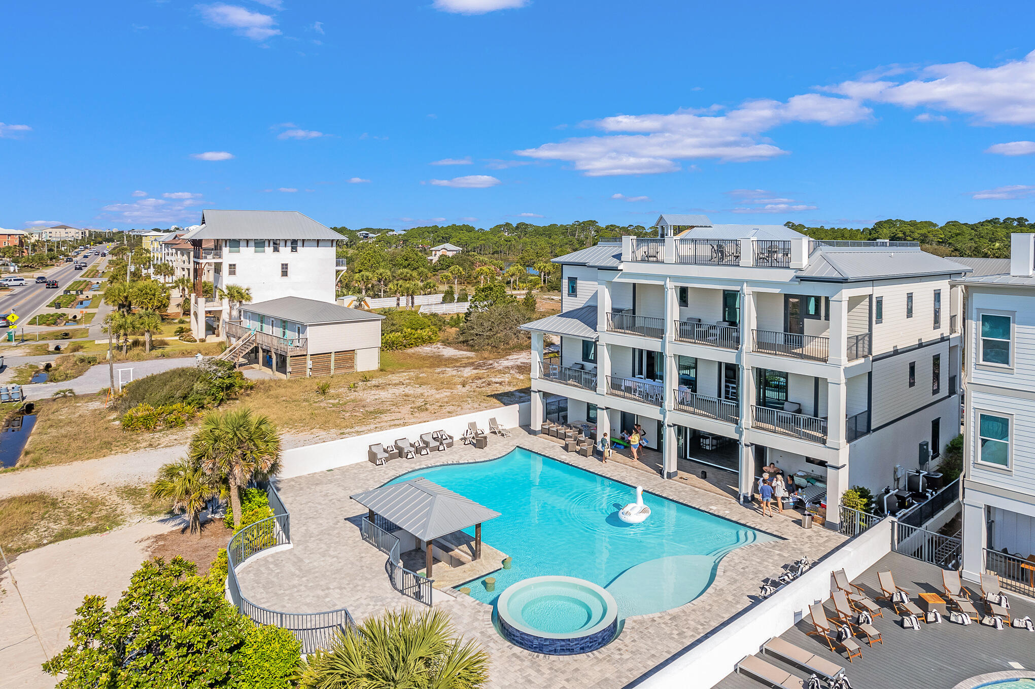 DUNE IT UP in Dune Allen welcomes you and your guests with beach house chic and a laid-back attitude.  The beach is just across the iconic beach road beloved as 30A. Looking for rental income? DUNE IT UP looks just as good on a spreadsheet as it does from the white sand beach.NO HOA keeps expenses low. HUGE PRIVATE POOL and pool deck directly on 30A. The view of the Gulf and beach from the top deck goes for miles. Large enough to handle a crowd, the deck has earned a reputation as the perfect spot for an event or to say 'I do.' Recently renovated with new living area furniture. Large bedrooms all offer king-size beds; kids love the bunk room. Two garages, plentiful parking and an elevator add value to this beach house.  Please continue reading ..