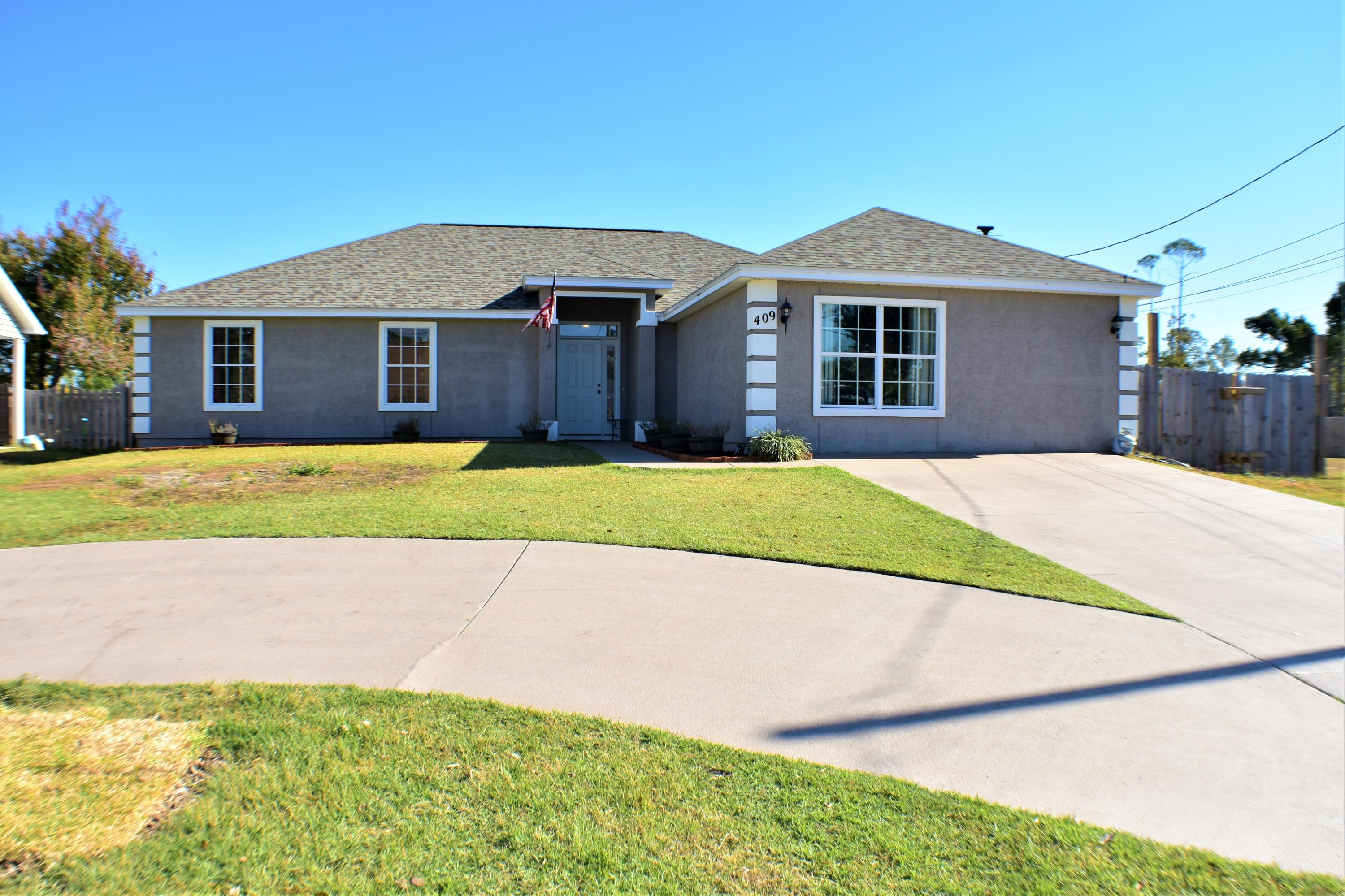 Need some growing room? This 4BR/2.5BA Lynn Haven home with a pool is ideal! The roof was replaced Jan 2019, the AC is only 3 months old, and you'll love the spacious-open floor plan w/split-bedrooms and a bonus room to boot! The flooring throughout most of the home is bamboo and the living area includes a fireplace. The large dine-in kitchen boasts granite countertops, stainless steel appliances, wine chiller, and a gas range. The tray ceiling in the master bedroom is a nice touch, the walk-in closet is custom fitted with organizers, and the master bath includes a double sinks, a shower, and a large jetted tub. The bonus room could be used as a guest room or media room; the attached closet/laundry room includes a half-bath. The stacked washer/dryer is on a dolly for easy cleaning!