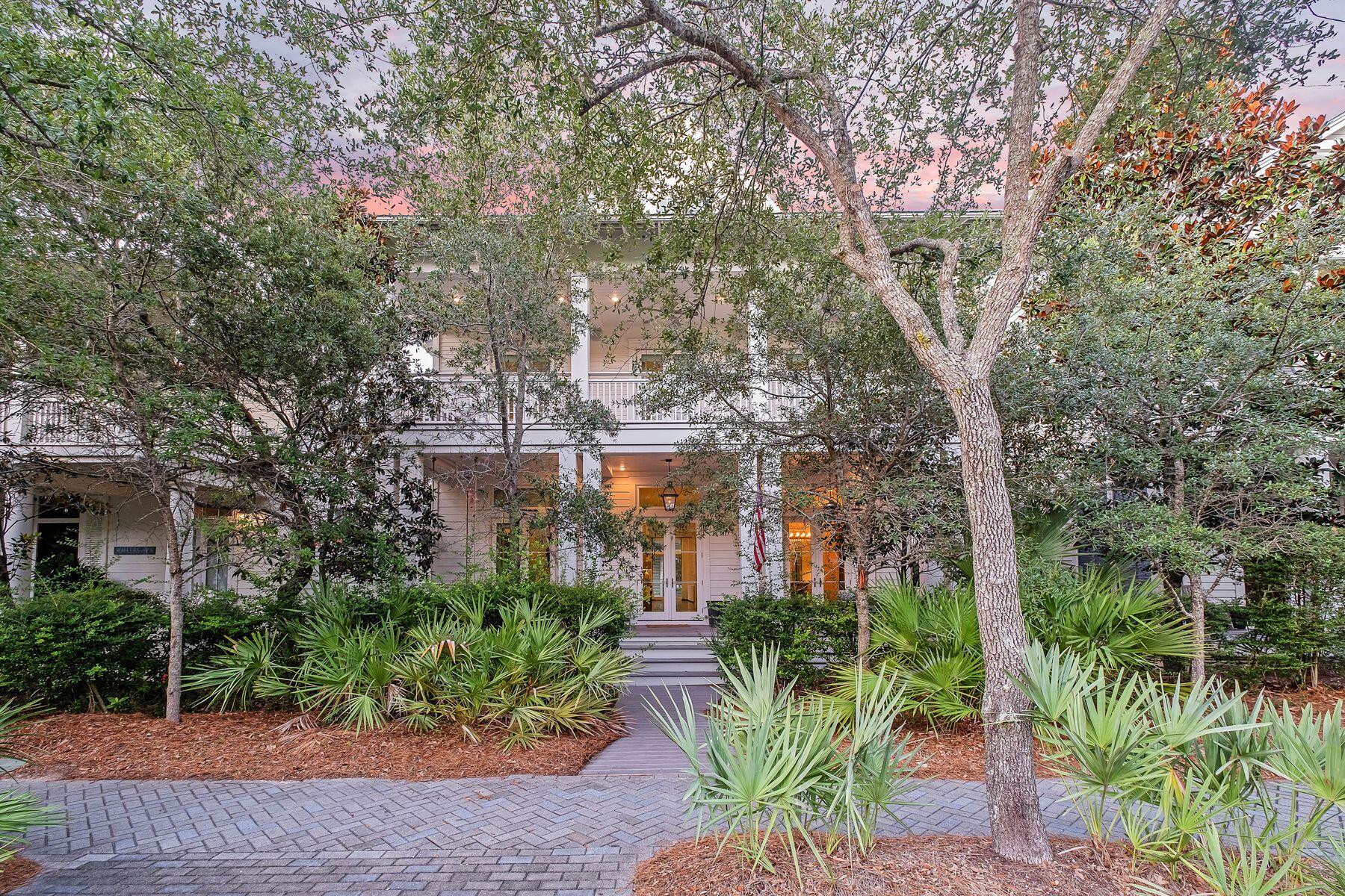 This WaterColor beach house has it all --  a private pool and carriage house, two master suites, a game room and a bunk room. It even includes a six-seat golf cart for getting around. Set behind a low hedge and screened by mature trees, this awe-inspiring residence on ''President's Row'' enjoys an unbeatable location. It's just blocks from the beach club, Camp WaterColor, Western Lake boathouse and 30A attractions. A decked front porch welcomes you with two swing benches for lazily watching the world go by. Indoors, the light and airy interiors feature white shiplap walls, contemporary lighting fixtures and sleek hardwood flooring. The huge open great room is perfect for entertaining with a seamless flow between multiple breakfast, formal dining and sitting areas.