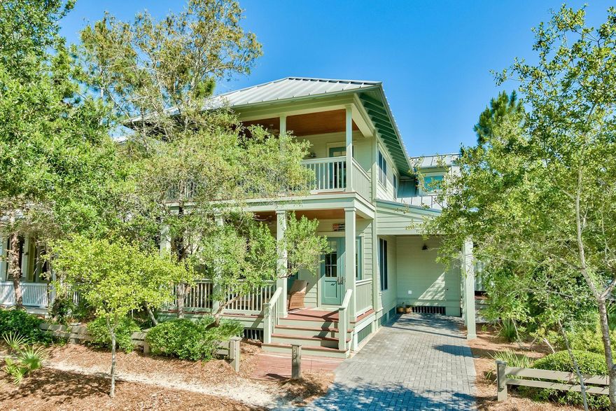 Enviably located overlooking the pond at Camp Watercolor, this four-bedroom, four-bath home has the high-quality build and amenities that define this active community. Ideal as a fun-filled single-family home or as a lucrative vacation rental, it comes fully furnished and includes a built-in bunk room. Coffered ceilings, spa bathrooms, a summer kitchen and wrap around deck are just some of the surprises in store. Wood floors create a seamless flow through the open-plan living room and kitchen with its superior fitments, island cooking station and soapstone-smooth granite counters. The adjoining dining area with built-in buffet is perfect for leisurely breakfasts or entertaining. Two master suites, one on each floor, negate the need for compromise.