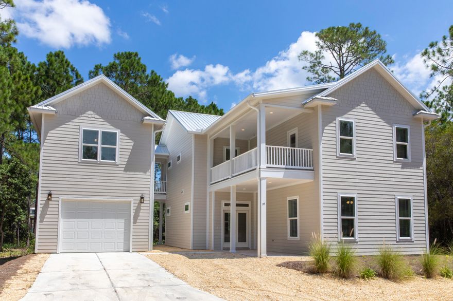 OPPORTUNITY KNOCKS! No HOA or rental restrictions! No FLOOD insurance required. Built 2019 with a CARRIAGE HOUSE! Beautifully FURNISHED and nestled amongst tall pines on a private gravel road, Old Seagrove meets Santa Rosa Beach, a quick golf cart or bike ride to the sandy beaches of Ed Walline. If you're looking for a luxury full time residence, you can use the carriage house as your office. Looking for a second home, or investment property look no further; this 4 bdrm 4 bath home has everything you're looking for and is completely turnkey and ready to generate a potential $50k/yr. Large 1/3 acre lot w/ plenty of room for a pool & outdoor kitchen. Zero maintenance landscape and a long driveway accommodating up to 6 cars! Minutes from Gulf Place & all it offers: shopping, dining & concerts