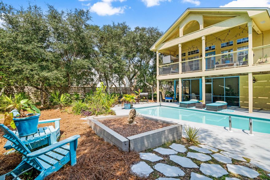 MORNIN' SUNSHINE! Fills the OPEN LIVING/DINING/KITCHEN of this home w/ high ceilings & tall windows. Walk out to the back deck and overlook the POOL AREA w/ mature LANDSCAPING & HUGE PRIVATE BACK YARD! Over 1500 sq ft of  porches & decks.  Screened porch downstairs adjacent to loggia area by pool. UPDATED APPLIANCES & a walk-in pantry, plus extra large storage closet. MASTER SUITE  has  HIS a& HER a walk-in closets. 2  BR share a bath downstairs. 2 car garage and lots of storage. Seabreeze subdivision has it's own beach access a short walk away. Seabreeze is a no short term rental community.