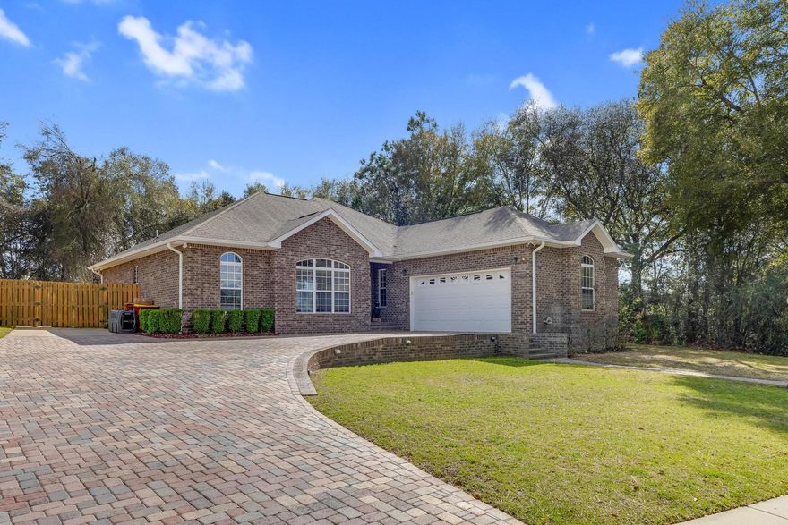 From the moment you drive up you will see an upgraded brick paved driveway with oversized parking. Everywhere you look you will see UPGRADES and realize this is not your standard house in the neighborhood! This four-bedroom, two-bathroom residence boasts an array of luxurious features that set it apart from the rest. From elegant 10/11 ft tray ceilings to exquisite crown molding, every detail exudes sophistication and style. Mahogany custom cabinets, granite countertops, split floor plan, upgraded primary bedroom/bathroom. If you love your pets, you will cherish the heated/cooled tiled 54 sq ft addition specially made for your four-legged family member! Situated in a prime location, this home offers unparalleled style, comfort and convenience. Comps do not do justice!