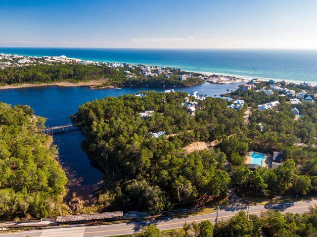 Great location for this larger lot on Draper Lake Village. Close to the water and the beach access. This lot is located next to the viewing tower, near the lighted path which leads to the western boathouse, and close to the community pool. Draper Lake Village is a quiet 30 A exclusive gated beach neighborhood that boasts a coastal dune lake that connects with the white sands of the Gulf. Ride your golf cart, paddle through the lake or drive your car to the beach access. Wonderful hidden gem in the heart of 30 A. This neighborhood is a must explore for those seeking peace and quiet for a permanent residence or a second home.