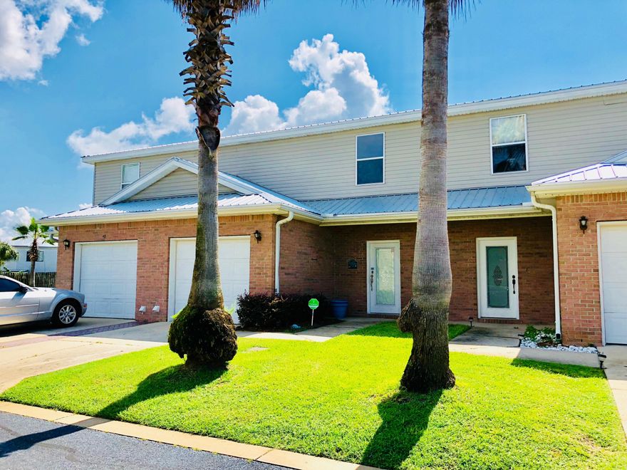 Don't miss out on a rare opportunity to own this well kept, move-in ready townhome in the heart of Destin. This spacious 3 bed, 2 1/2 bath is more privately located towards the back of the complex and just next to an end unit. It has a large kitchen with breakfast bar, white cabinetry and a double stainless sink. There is lots of counter space and all the appliances convey. A/C and roof was replaced in Dec. 2017. His & her closets in the master bedroom and hook up for a washer & dryer is in the garage. Community pool. There are 20 spillover parking spots available. 8 of which are close to this unit(see photo). Make your appointment today!