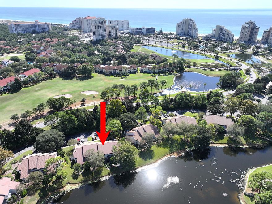 Back on the market and priced to move after getting an entirely new roof, completed in May of 2025, along with renovating the magnificent ceiling window and window wall alcove in the dining room that is adjacent to the entry, providing a solarium-type feel and wash of natural light through the condo as you enter.  This beautiful Beachwalk Villa is being sold as viewed with everything, including its own Golf Cart!  It is turn-key ready to rent and less than a block from the beach.  It has wonderful views of Horseshoe Lake and has been updated with stainless appliances.  The furniture and houseware all convey.  Make the call today to see if you can get in to view it for yourself as it is persistently rented.